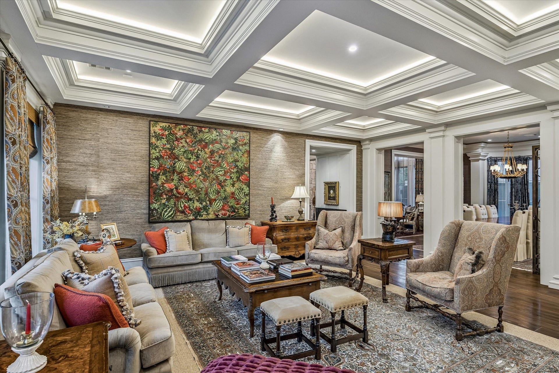 2158 Chilton Road, Houston, TX 77019 A beautifully appointed gathering space with rich textures, custom ceiling beams, and a striking fireplace focal point. Remote wooden shades enhance everyday living while maintaining a refined aesthetic.