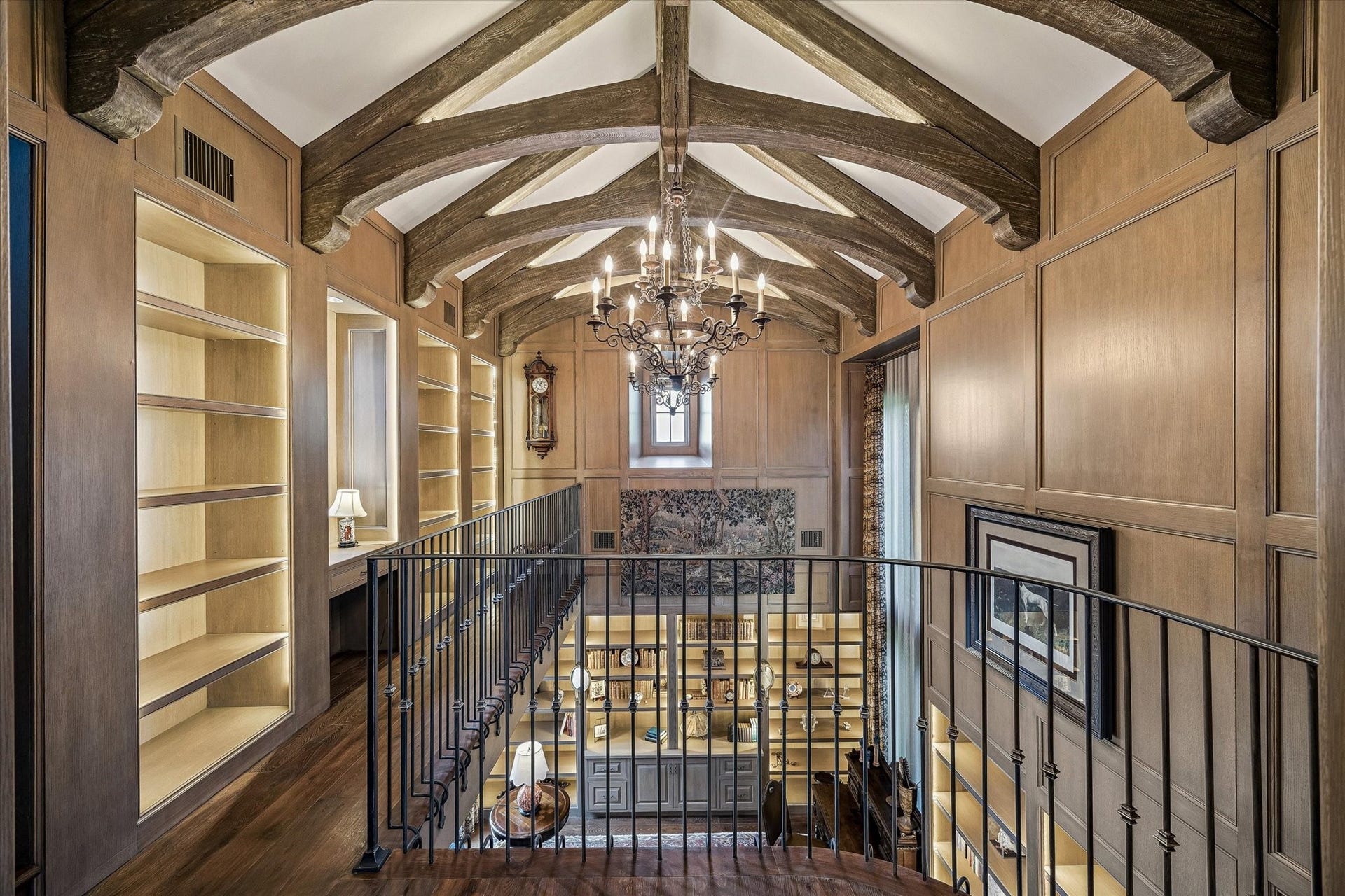 2158 Chilton Road, Houston, TX 77019 The second-floor library features custom built-in bookshelves with backlighting, perfectly combining style and function. This elegant display offers ample storage while enhancing the rooms sophisticated, light-filled ambiance.