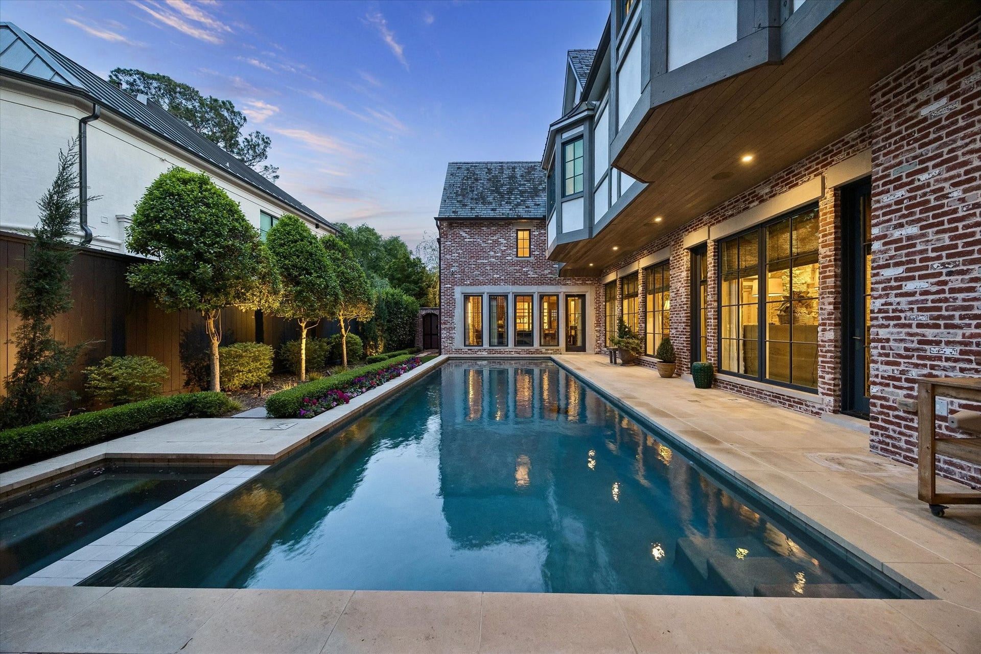 2158 Chilton Road, Houston, TX 77019 The sparkling pool and spa, complete with a heater and outdoor shower, create a resort-style backyard retreat. Lush landscaping, turfed yard, landscape lighting, and hand-laid brick hardscaping enhance both beauty and functionality. A generator provides peace of mind.