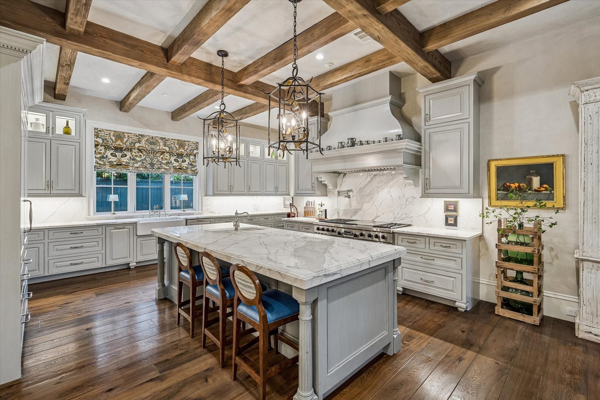 2158 Chilton Road, Houston, TX 77019 Thoughtfully designed for everyday living, the kitchen boasts top-tier appliances, a spacious polished marble island, apron front sink, and a walk-in pantry. Elegant finishes and a beamed ceiling elevate the space with timeless sophistication.