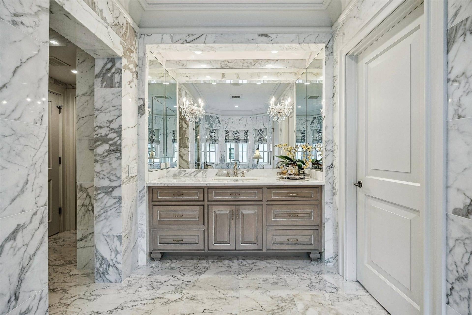 2158 Chilton Road, Houston, TX 77019 Sophisticated finishes abound in this marble-clad bathroom, featuring Toto bidets, decorative wallpaper, and recessed ceiling speakers. Two separate water closets provide privacy and convenience.