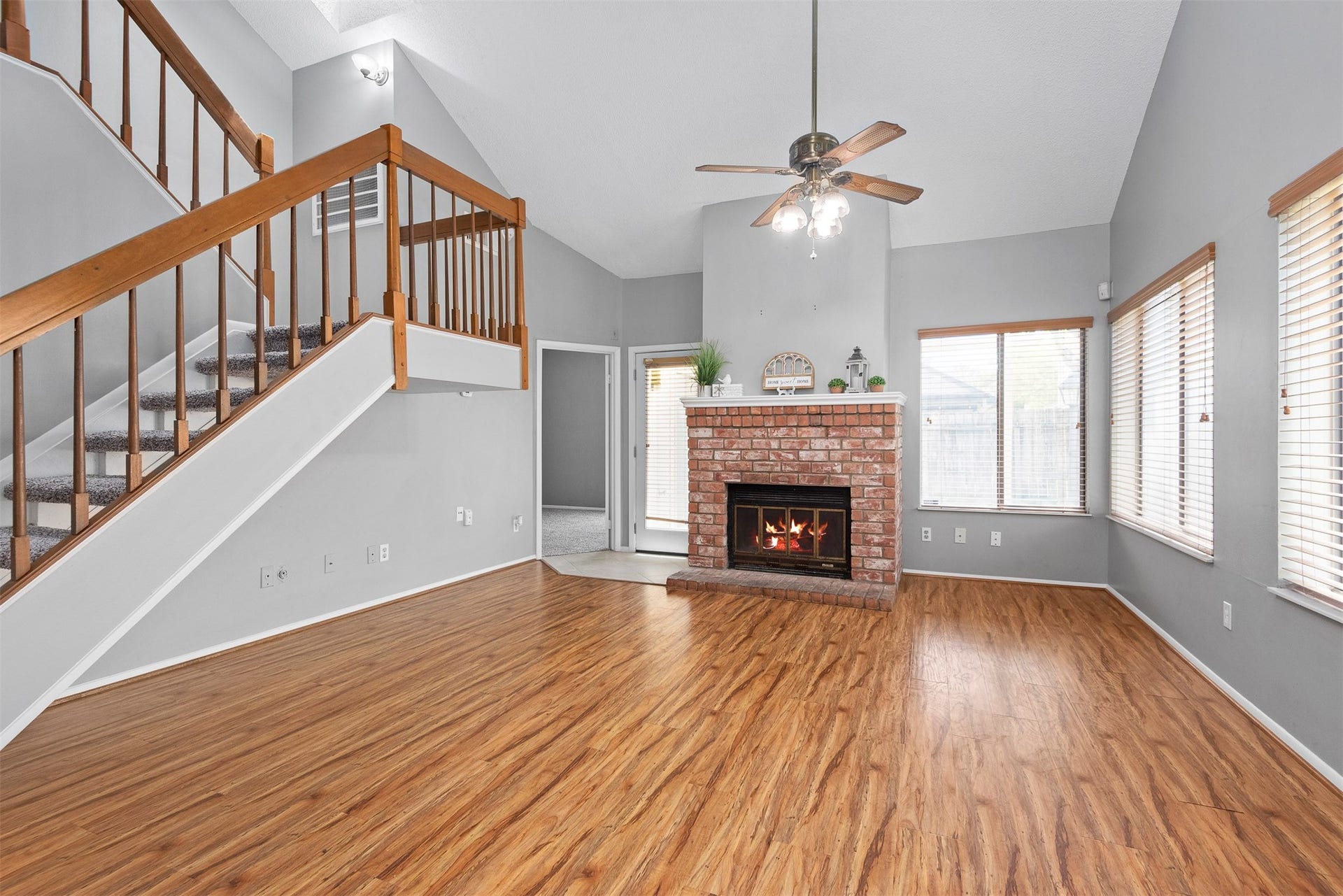 The spacious living area is the perfect spot for everyone to gather.  It's conveniently located near the kitchen, dining area and the back door.