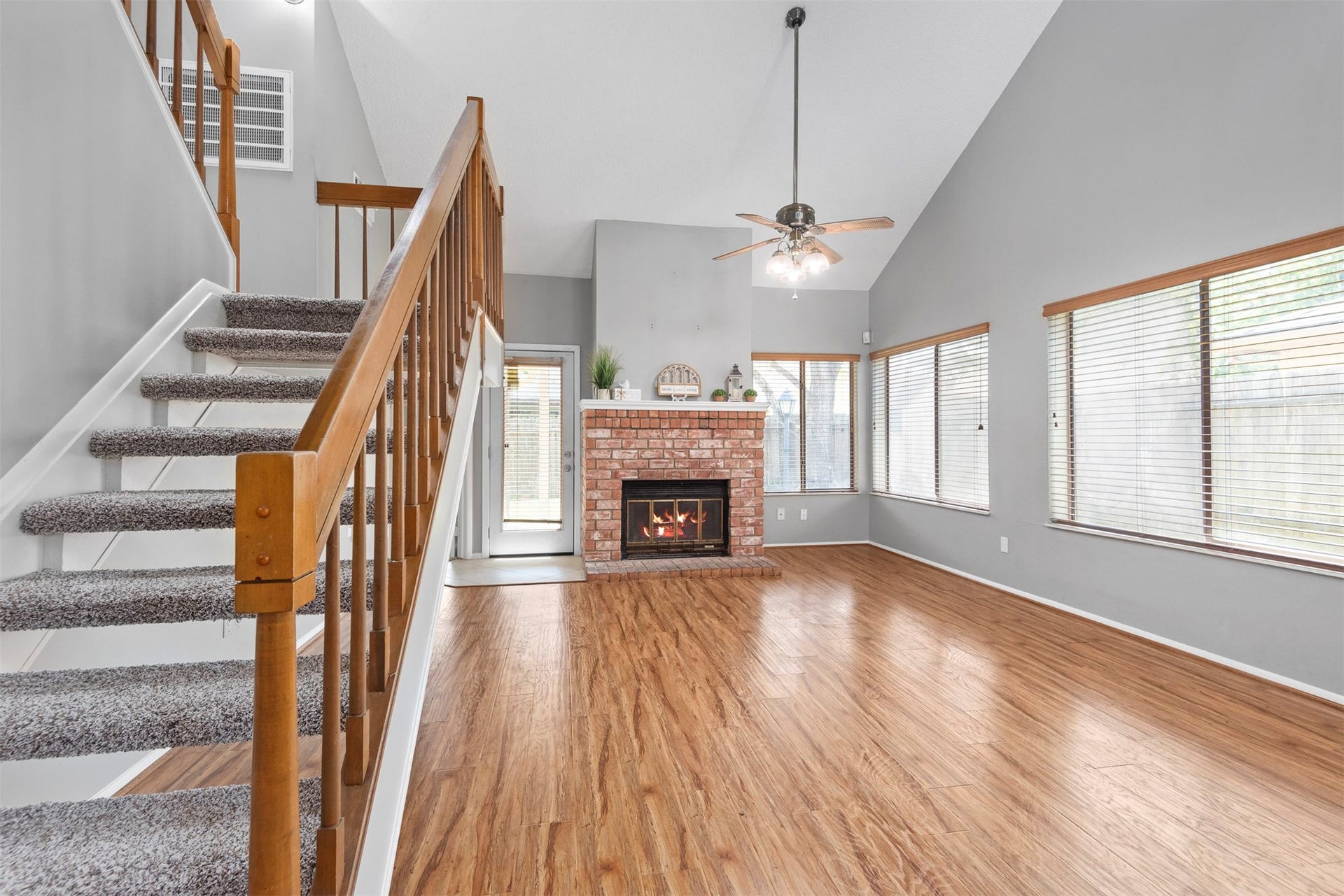 The soaring ceiling and wall of windows create an openness to the space.