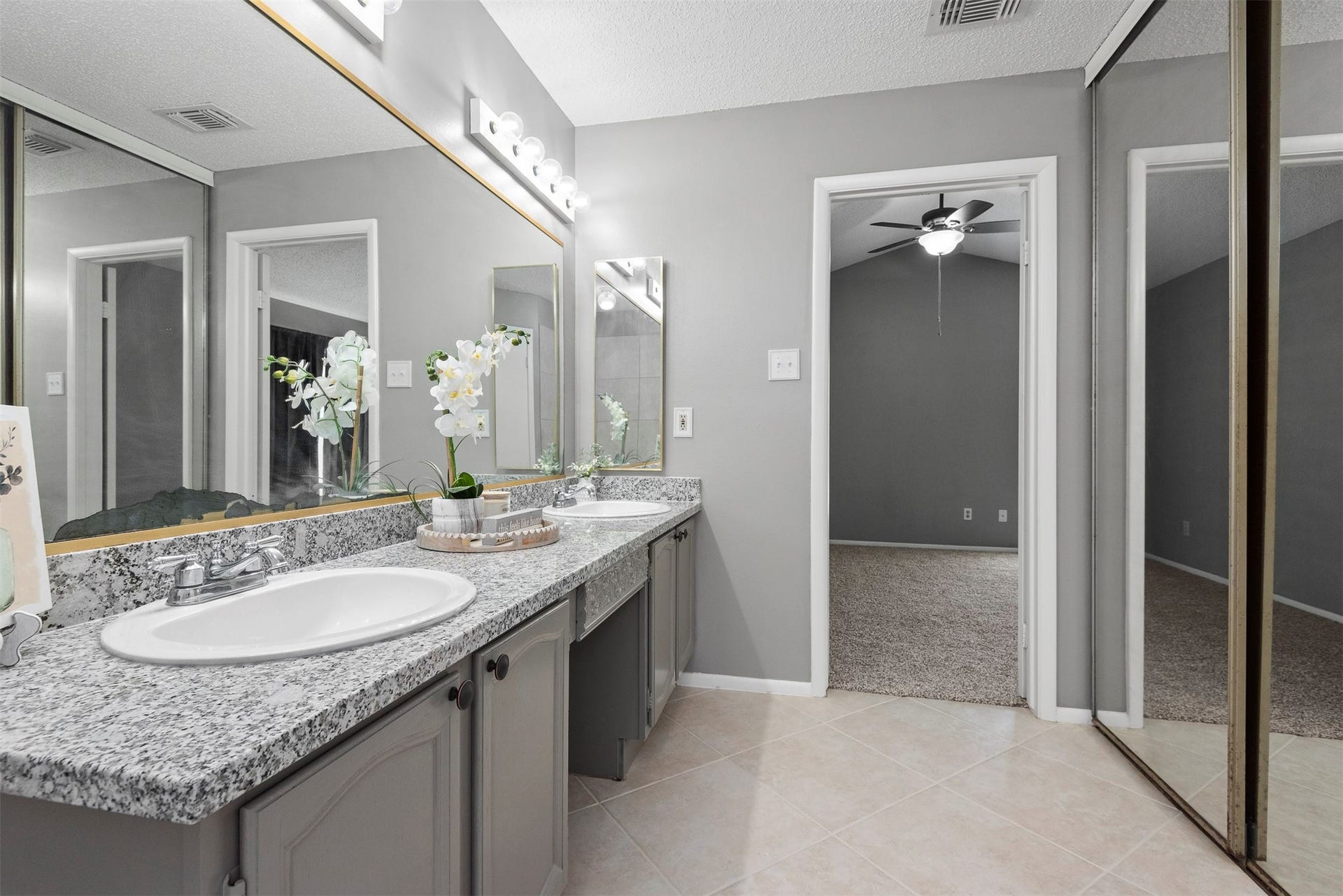 The primary bathroom is updated with neutral paint colors and granite.