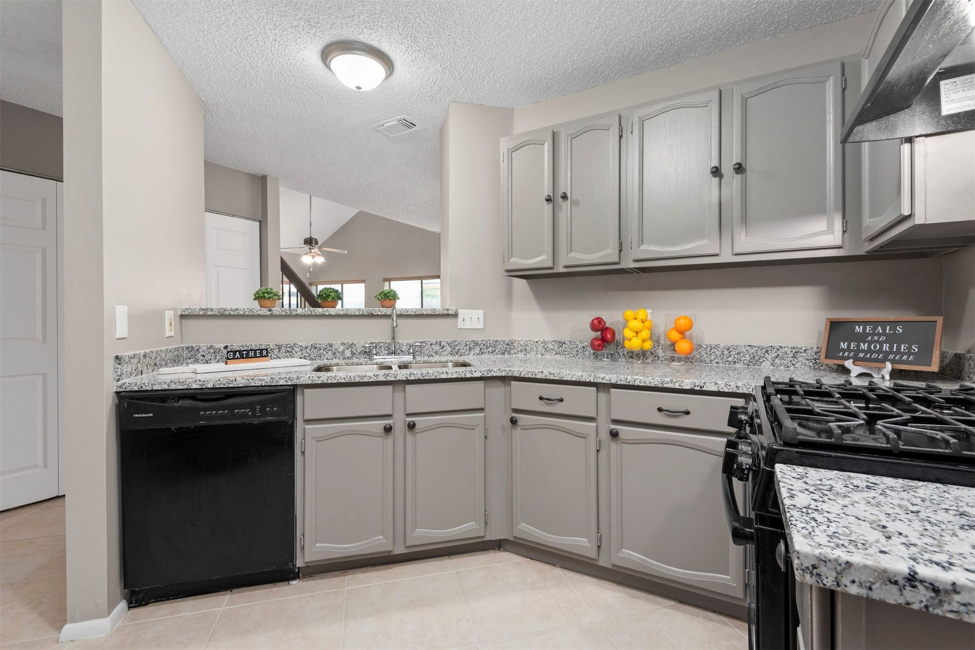 This amazing kitchen has ample counter and cabinet space, a gas stove, and granite countertops.