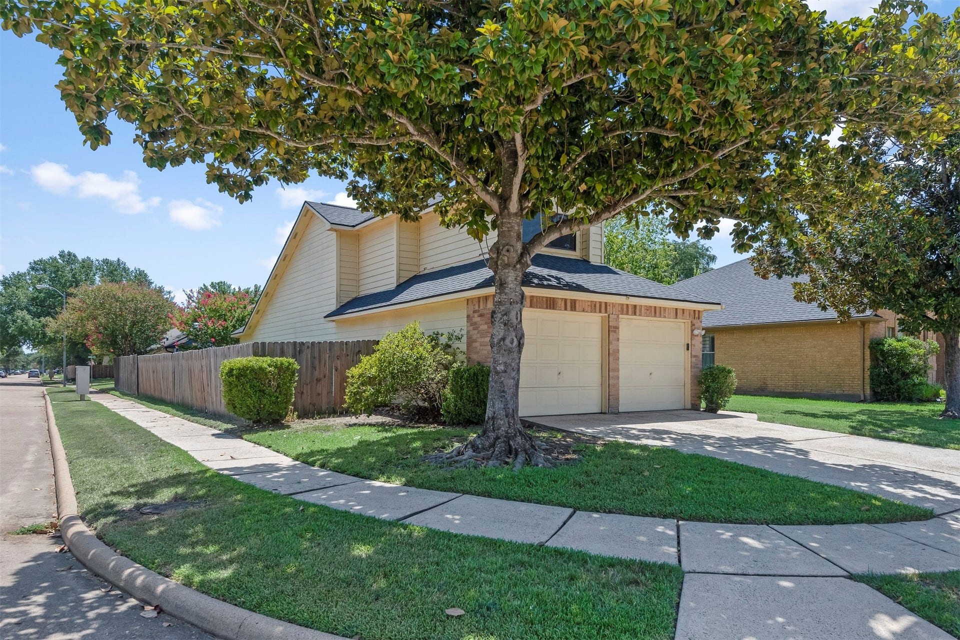 The large mature trees in the front and back yards offer ample shade.