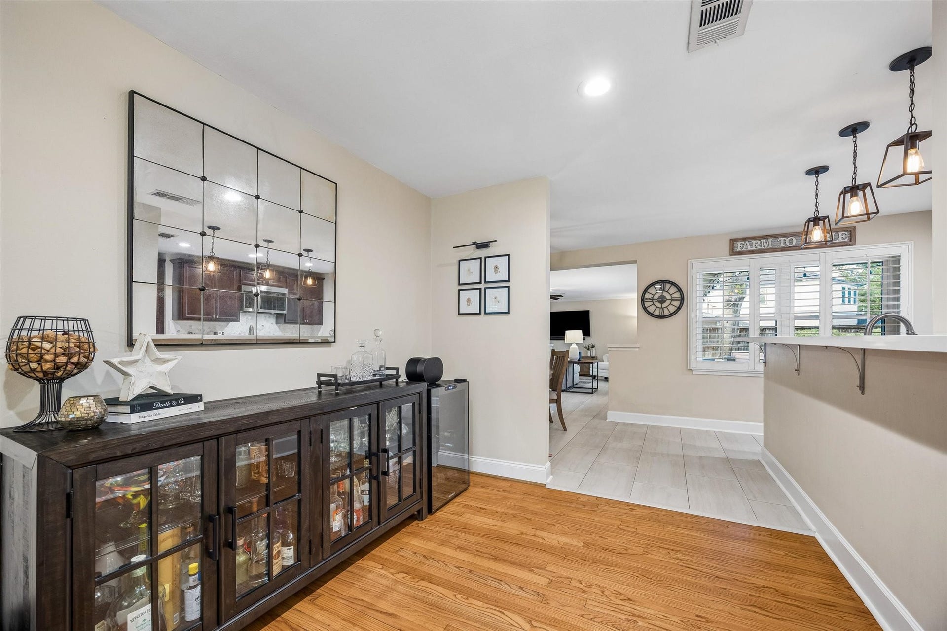 2318 Cheshire Lane, Houston, TX 77018 Direct access between the dining area and kitchen simplifies serving and cleanup. Open sightlines allow conversation to continue between the spaces, supporting the home's easy flow for daily routines and entertaining.