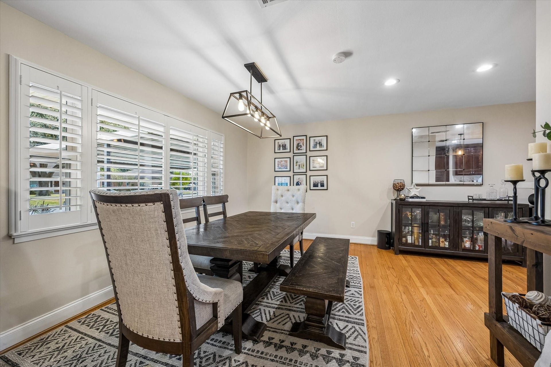 2318 Cheshire Lane, Houston, TX 77018 Shuttered windows bring natural light into the front dining area while allowing privacy control. Positioned beside the kitchen, this defined gathering space works well for everyday meals and larger occasions.