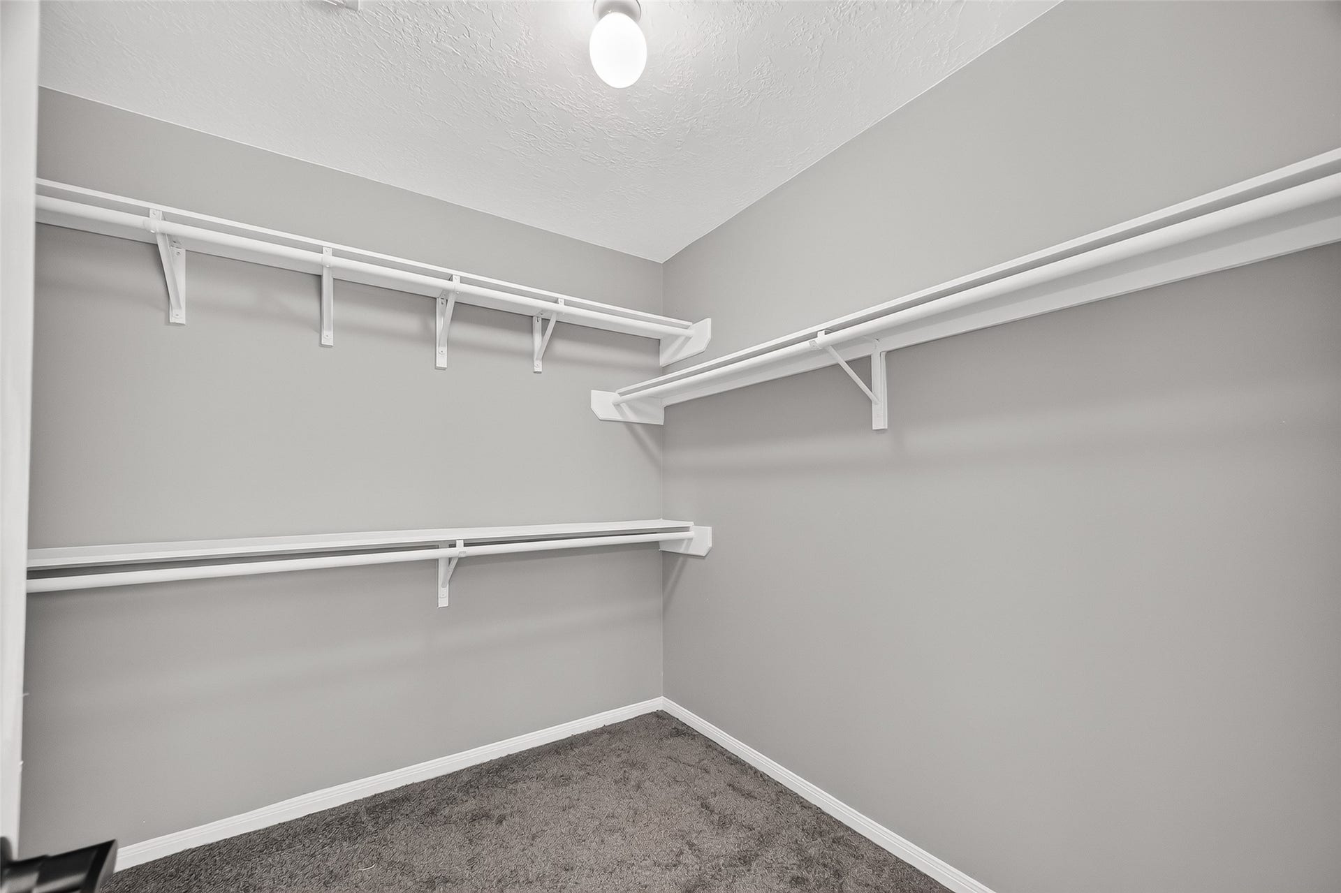 12823 Lady Jane Court, Houston, TX 77044 Spacious walk-in closet with ample shelving and hanging space, perfect for organizing your wardrobe.