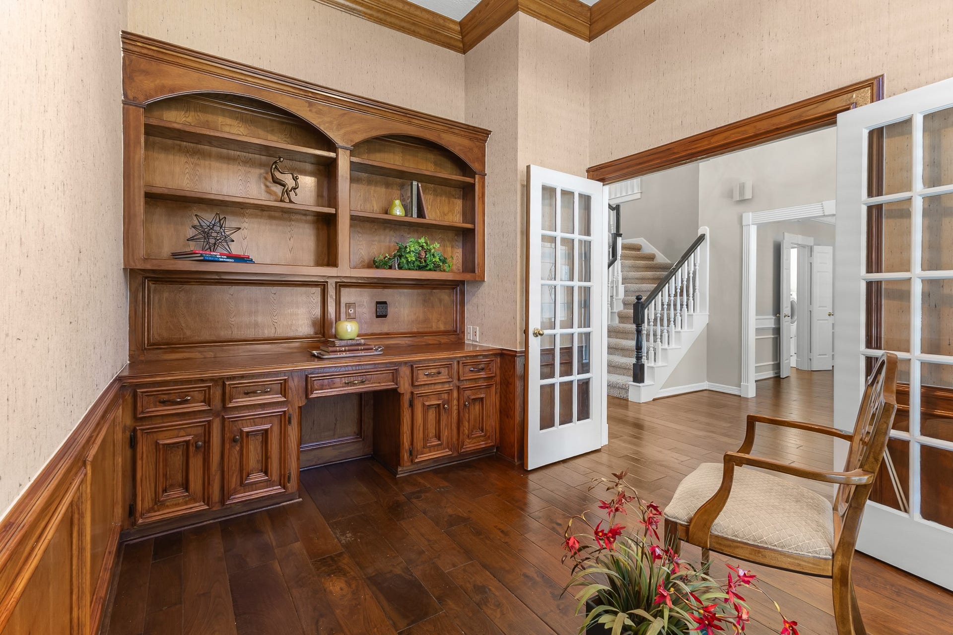 16314 Graven Hill Drive, Spring, TX 77379 Custom-style wood cabinetry and an integrated desk create a distinguished workspace with timeless character.