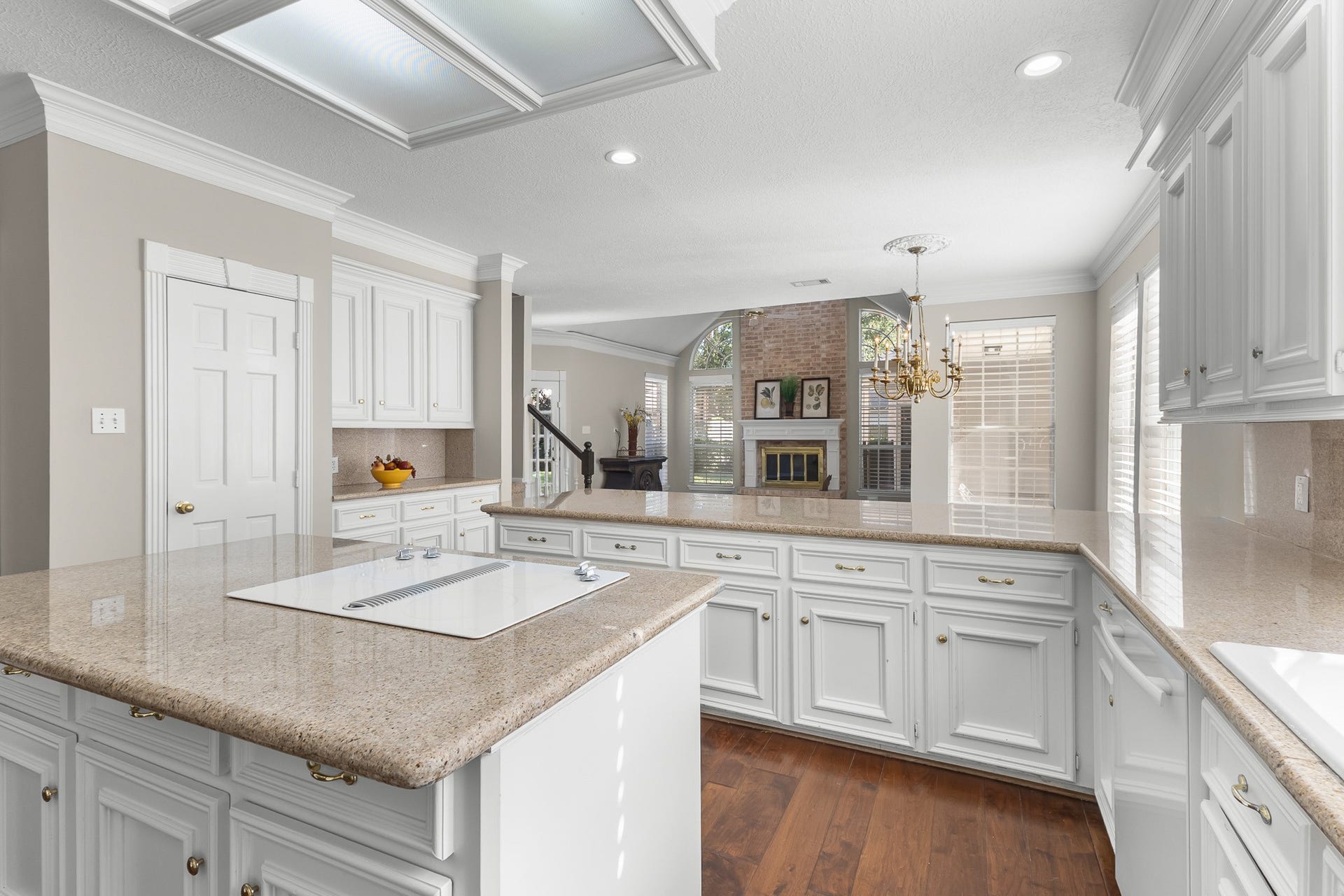 16314 Graven Hill Drive, Spring, TX 77379 A spacious island anchors the kitchen, surrounded by extensive cabinetry and connected to the adjoining living areas.
