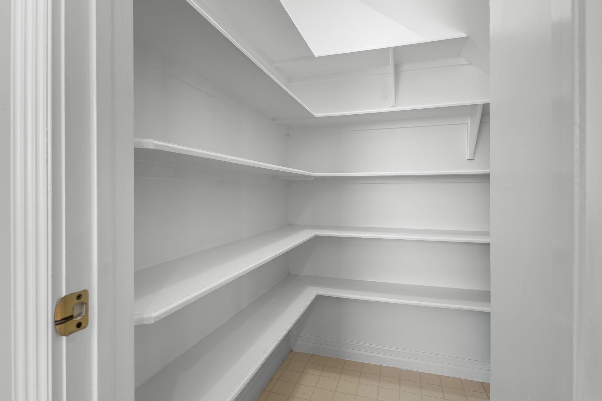 16314 Graven Hill Drive, Spring, TX 77379 A spacious walk-in pantry with wraparound shelving offers plentiful room for dry goods, serving pieces and kitchen essentials.
