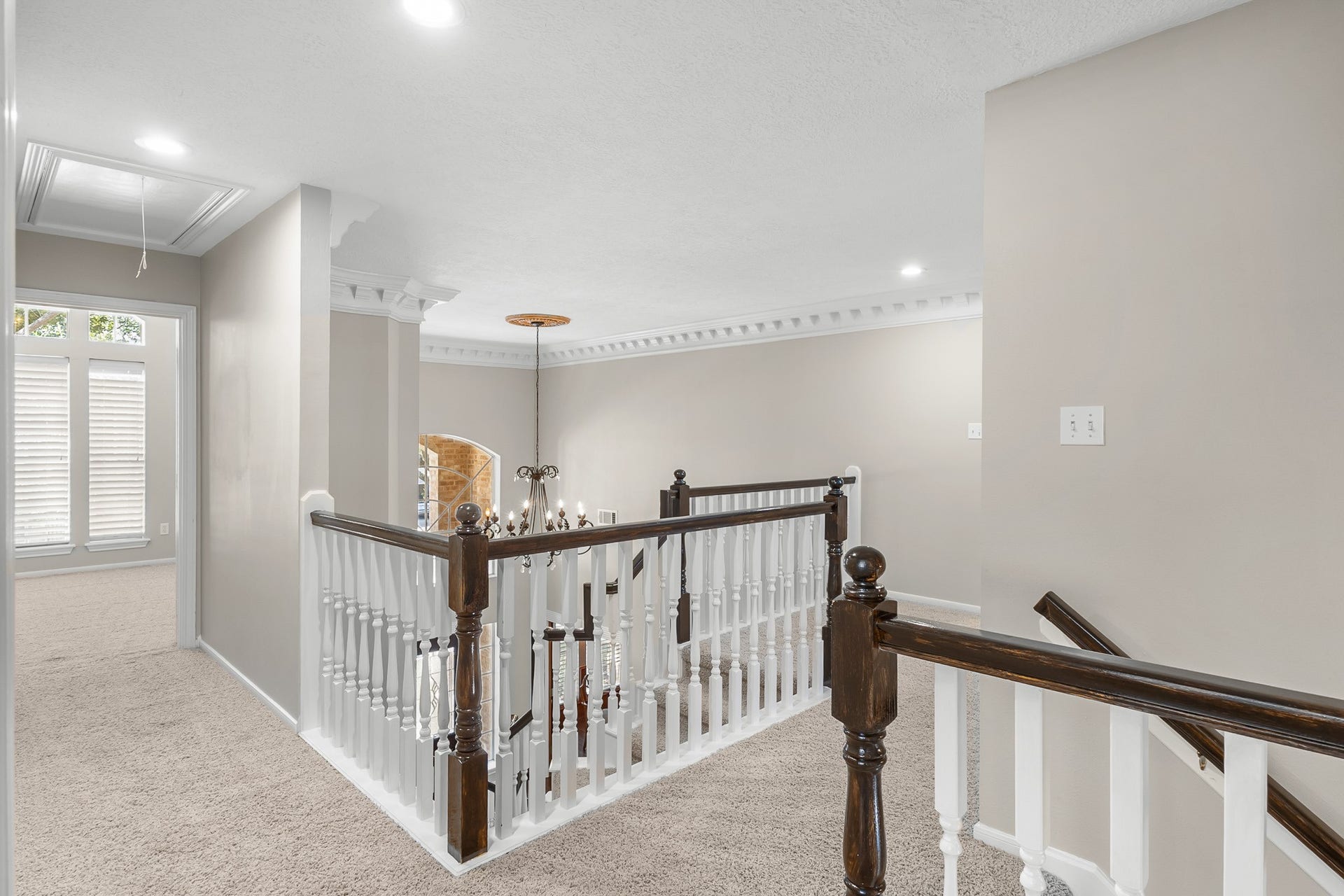 16314 Graven Hill Drive, Spring, TX 77379 An elevated perspective showcases the open foyer below and the architectural volume connecting the homes two levels.