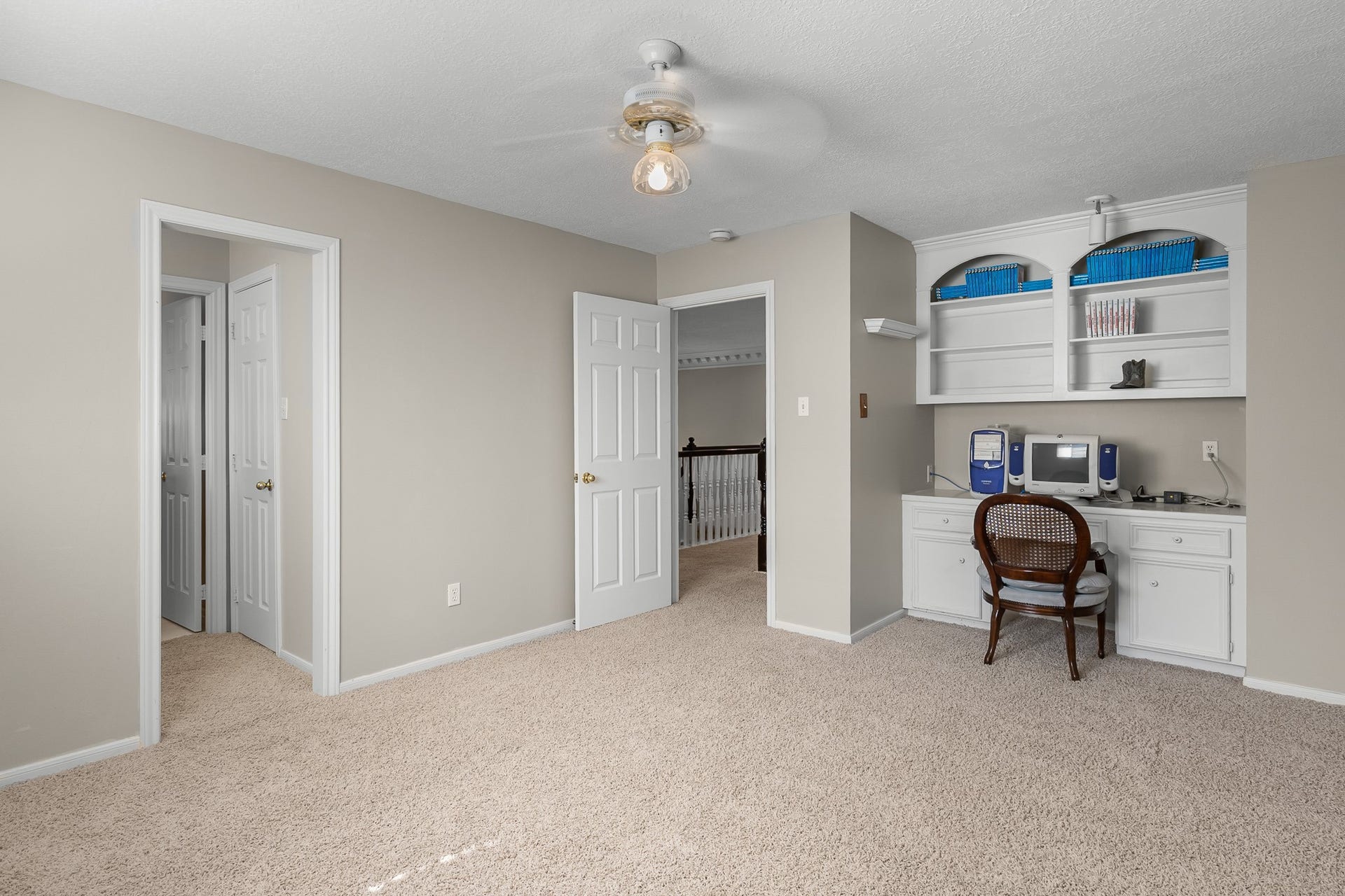 16314 Graven Hill Drive, Spring, TX 77379 Integrated desk and shelving provide a practical workspace within this flexible bedroom, ideal for studying, hobbies or working from home.