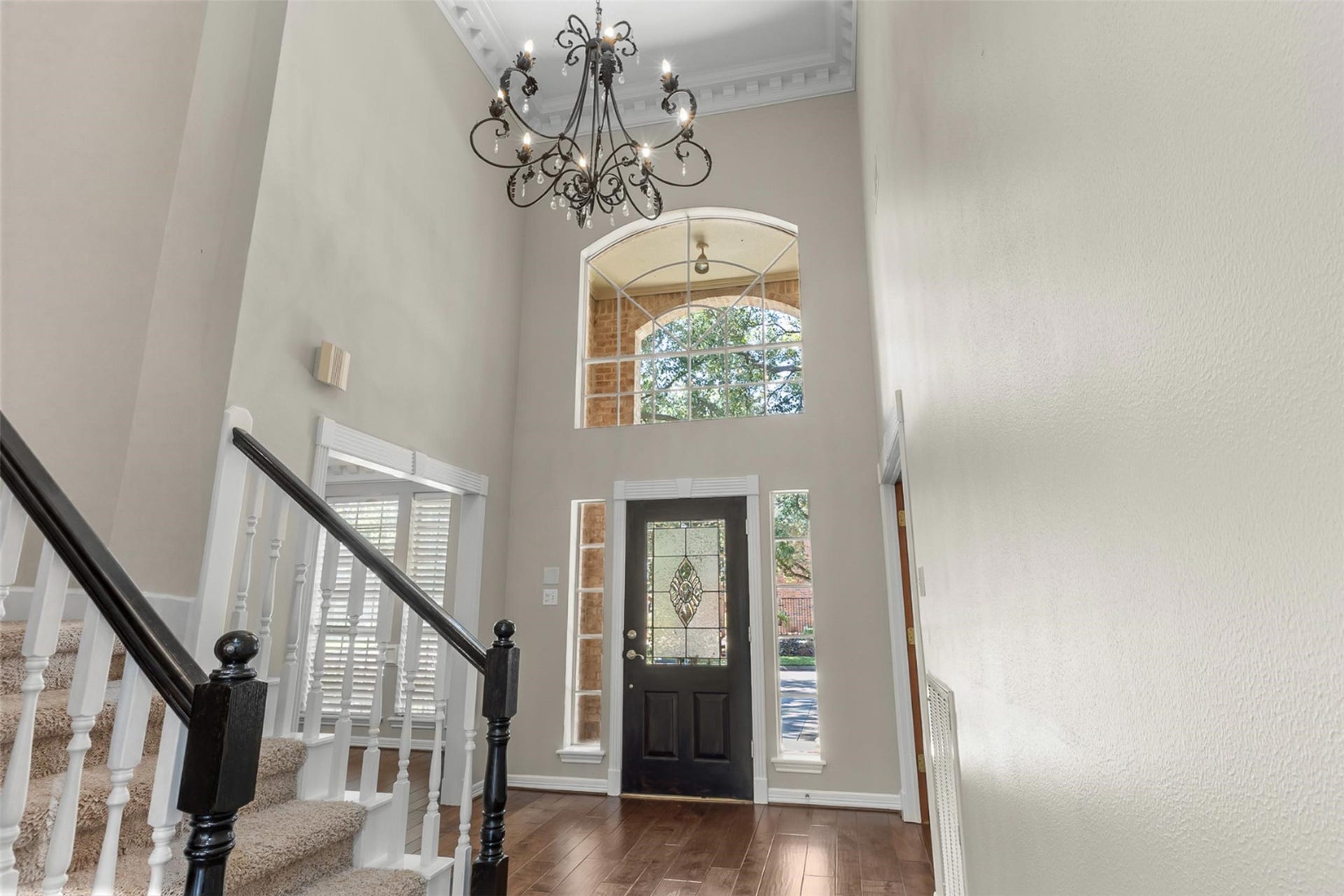 16314 Graven Hill Drive, Spring, TX 77379 Beautiful chandelier graces the entry. This elegant fixture serves as a stunning focal point, casting a warm and inviting glow