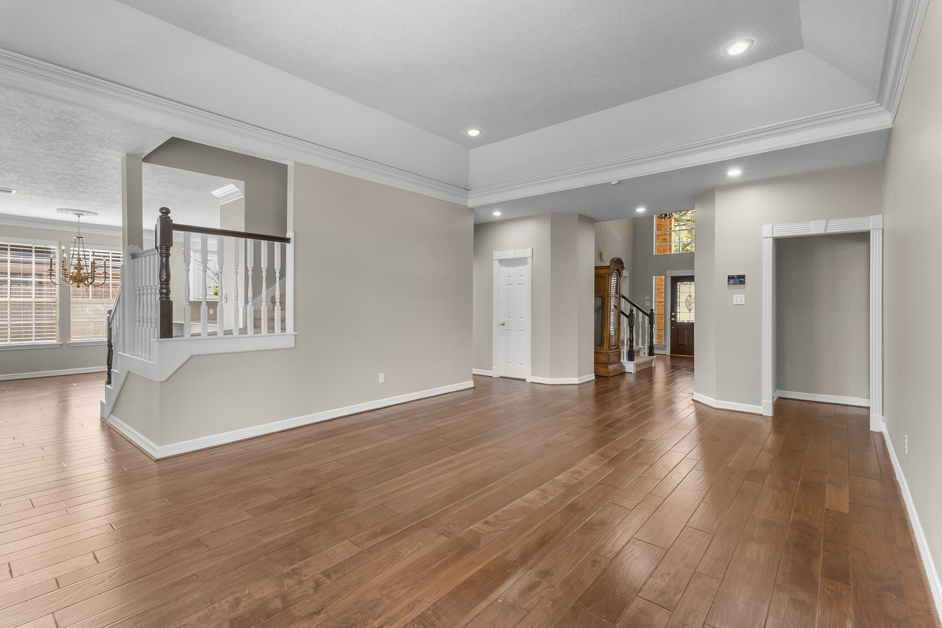 16314 Graven Hill Drive, Spring, TX 77379 An expansive view highlights the rooms flexible layout, elegant ceiling details and seamless connection to the adjoining spaces.