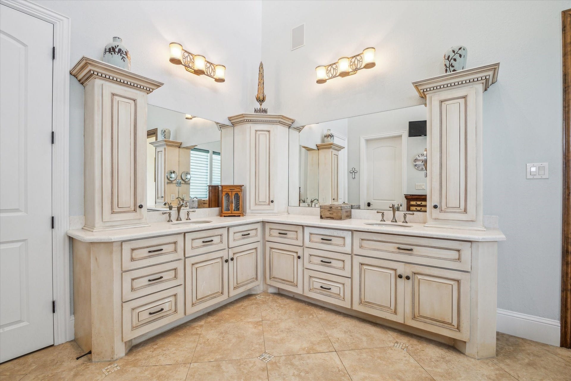 9 Happy Jack, Hitchcock, TX 77563 The primary bath impresses with a soaring 19-foot ceiling, dual sinks, and custom vanity-top cabinetry, creating a spa-like retreat that blends grandeur with everyday functionality