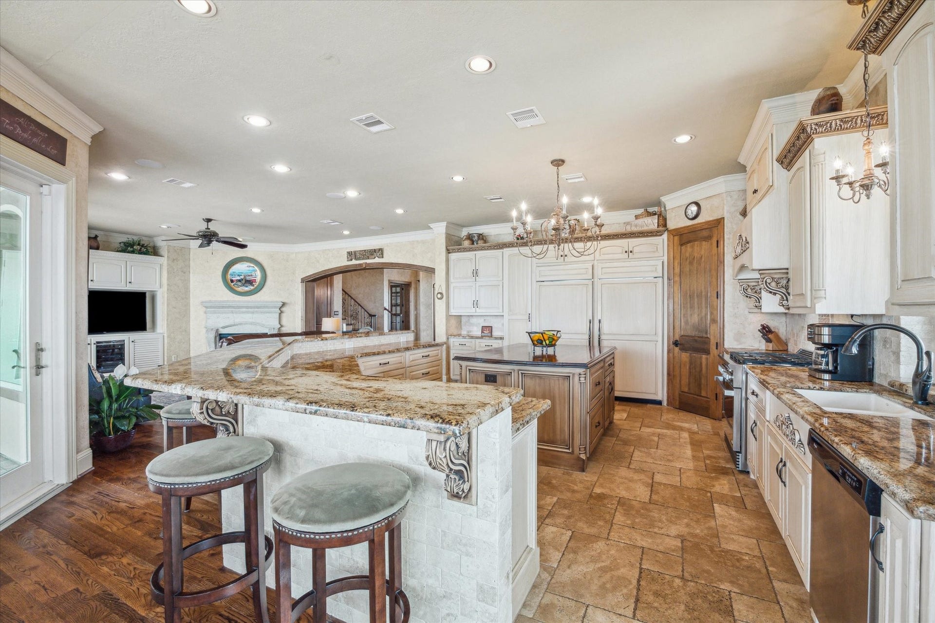 9 Happy Jack, Hitchcock, TX 77563 The kitchen features a Sub-Zero 20 cu. ft. refrigerator, 19.3 cu. ft. freezer, a 36-inch DCS 6-burner natural gas range with convection oven, and a large breakfast bar open to the living area.