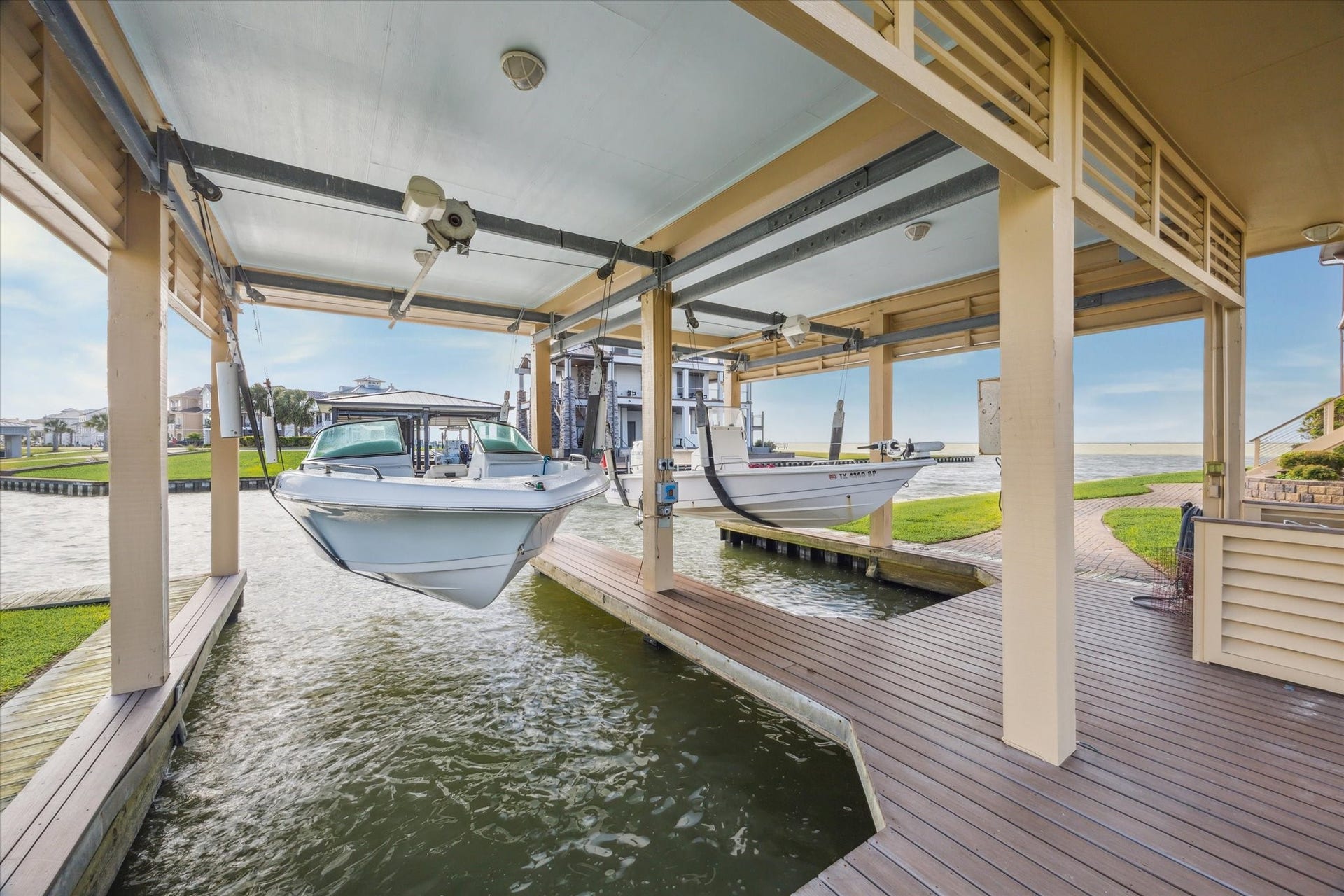 9 Happy Jack, Hitchcock, TX 77563 The boat house is built over a double slip and features separate steel-mounted lifts with capacities of 7,500 lbs. and 6,000 lbs. Designed for secure and convenient boat storage. A fish cleaning station is also included
