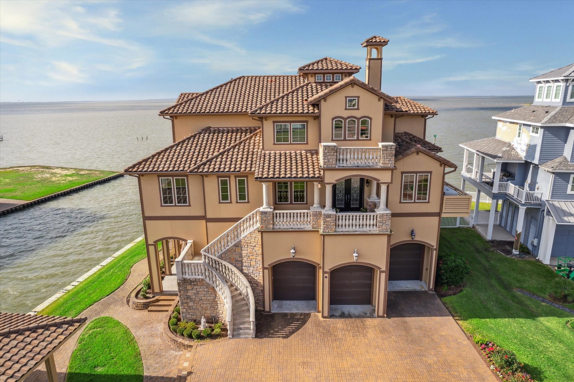 9 Happy Jack, Hitchcock, TX 77563 Welcome to 9 Happy Jack, Offering the VERY BEST views of West Galveston Bay with the ULTIMATE HOME CONSTRUCTION! Remote controlled hurricane shutter installed on front doors. Home exterior is made of Hardie plank covered by a textured acrylic
topping that is sculpted to make a veneer that resembles finished Stucco