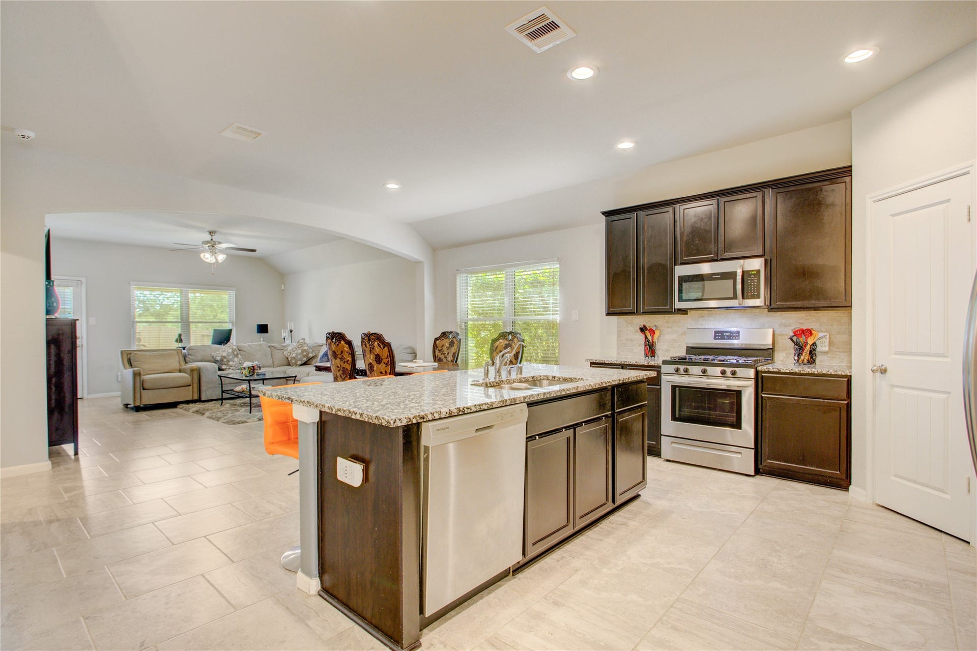 The heart of the home! An open-concept kitchen flows effortlessly into the dining and living areas, perfect for everyday living and entertaining.
