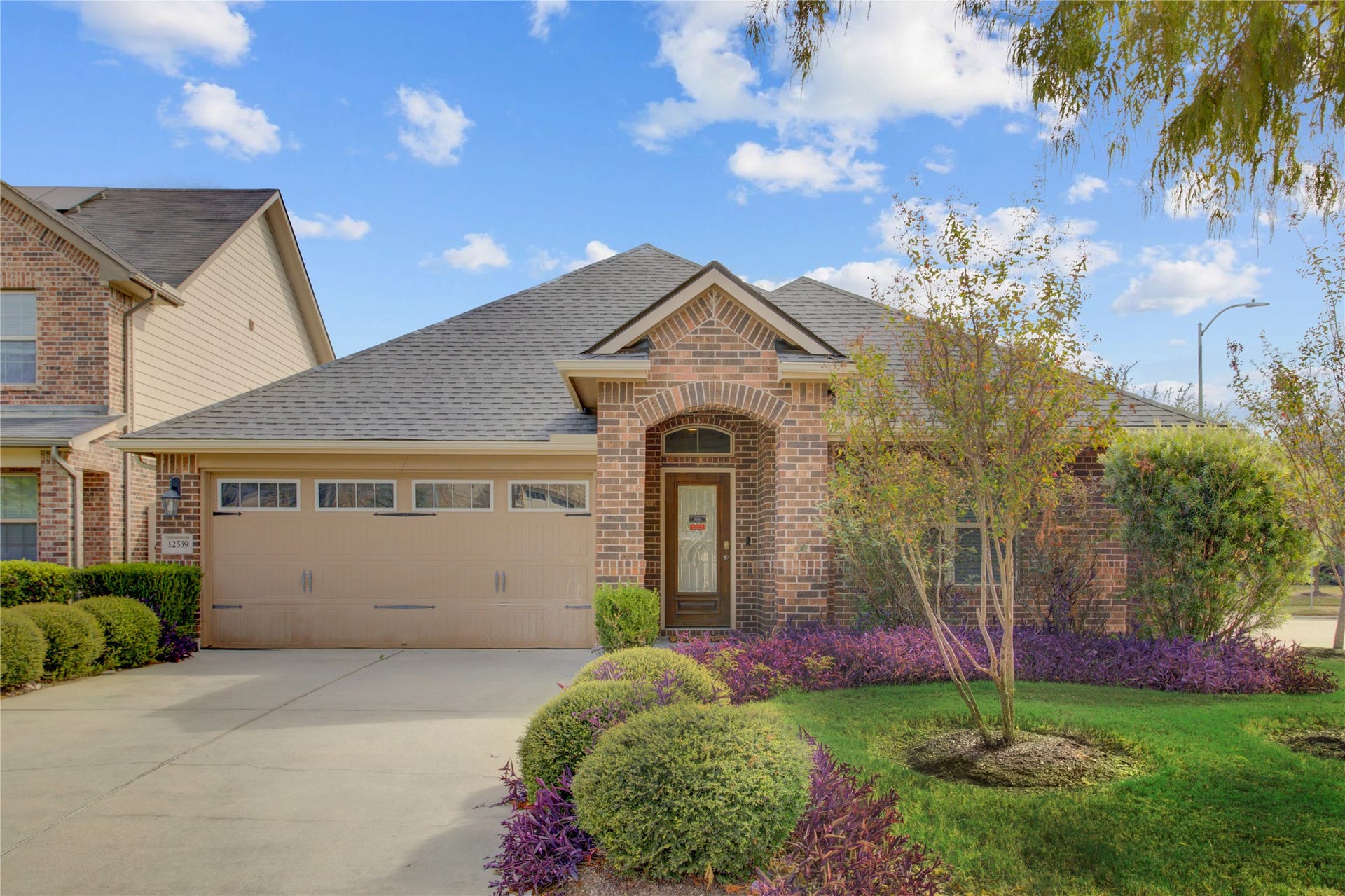 Welcome home! Beautiful brick exterior, arched entry, manicured landscaping, and an inviting covered front porch set the tone for your NEW HOME!