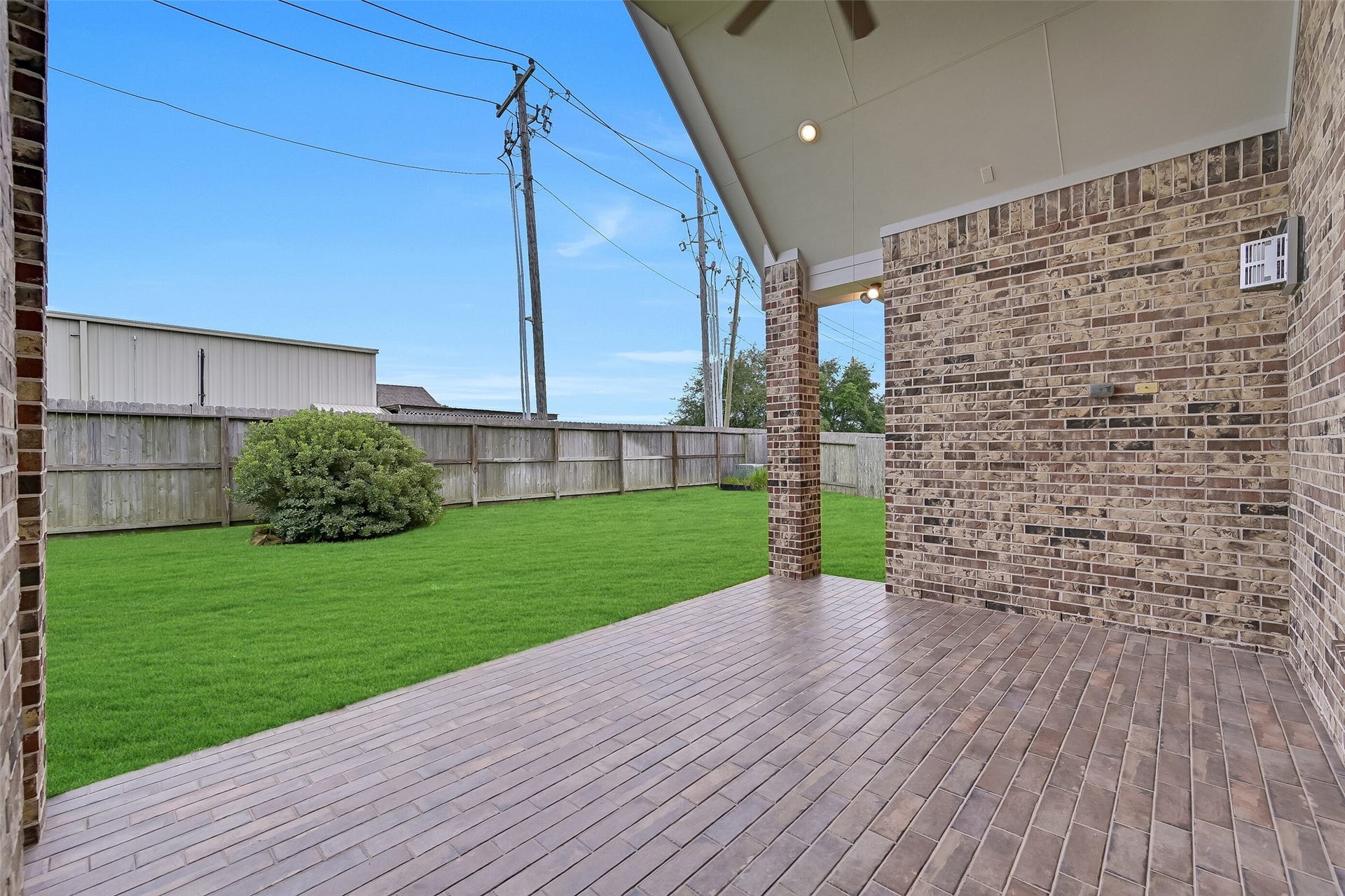 1321 Summer Field Lane, Friendswood, TX 77546 Step outside to a spacious covered patio designed for year-round enjoyment. The vaulted ceiling, ceiling fan, recessed lighting, and generous footprint provide the perfect setting for outdoor dining, grilling, or relaxing with friends while overlooking the expansive backyard. With plenty of room to add an outdoor kitchen, this space is ready to become your favorite gathering spot.