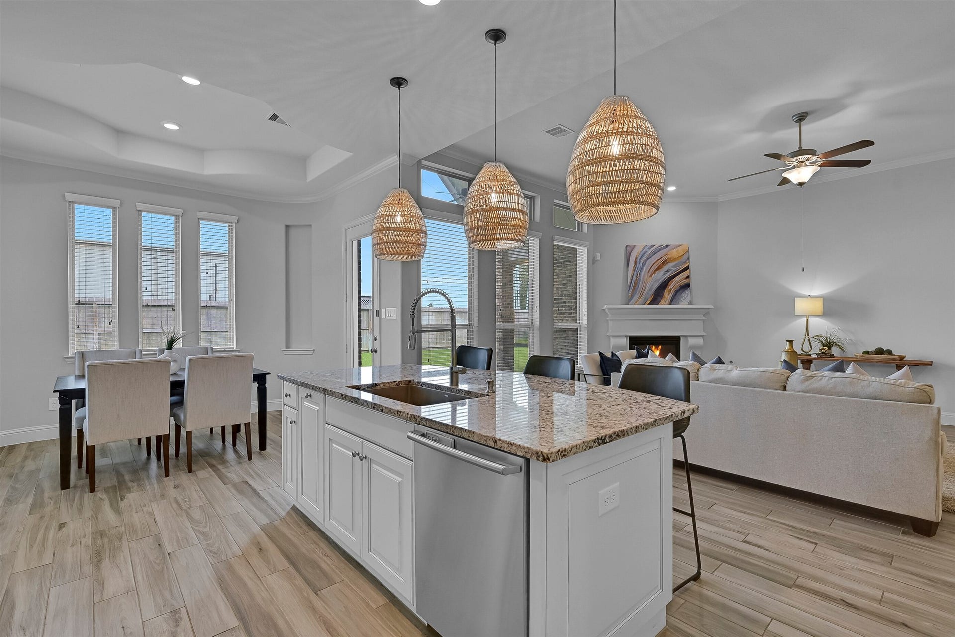 1321 Summer Field Lane, Friendswood, TX 77546 The open layout allows the kitchen, breakfast room, and family room to function as one cohesive space. Whether preparing meals, gathering around the island, or relaxing by the fireplace, everyone stays connected within the heart of the home.