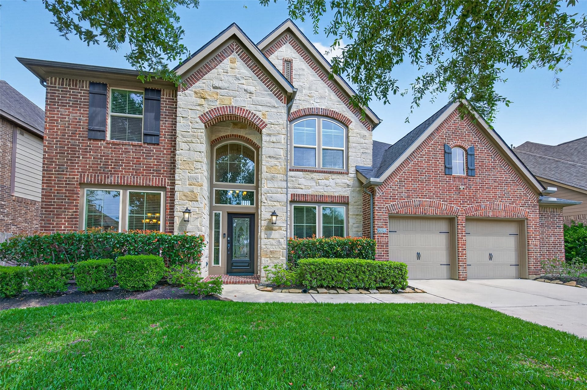 Welcome to 3514 Winding Point Ln. This beautiful two-story home features a mix of brick and stone exterior, and a well-maintained front lawn!
