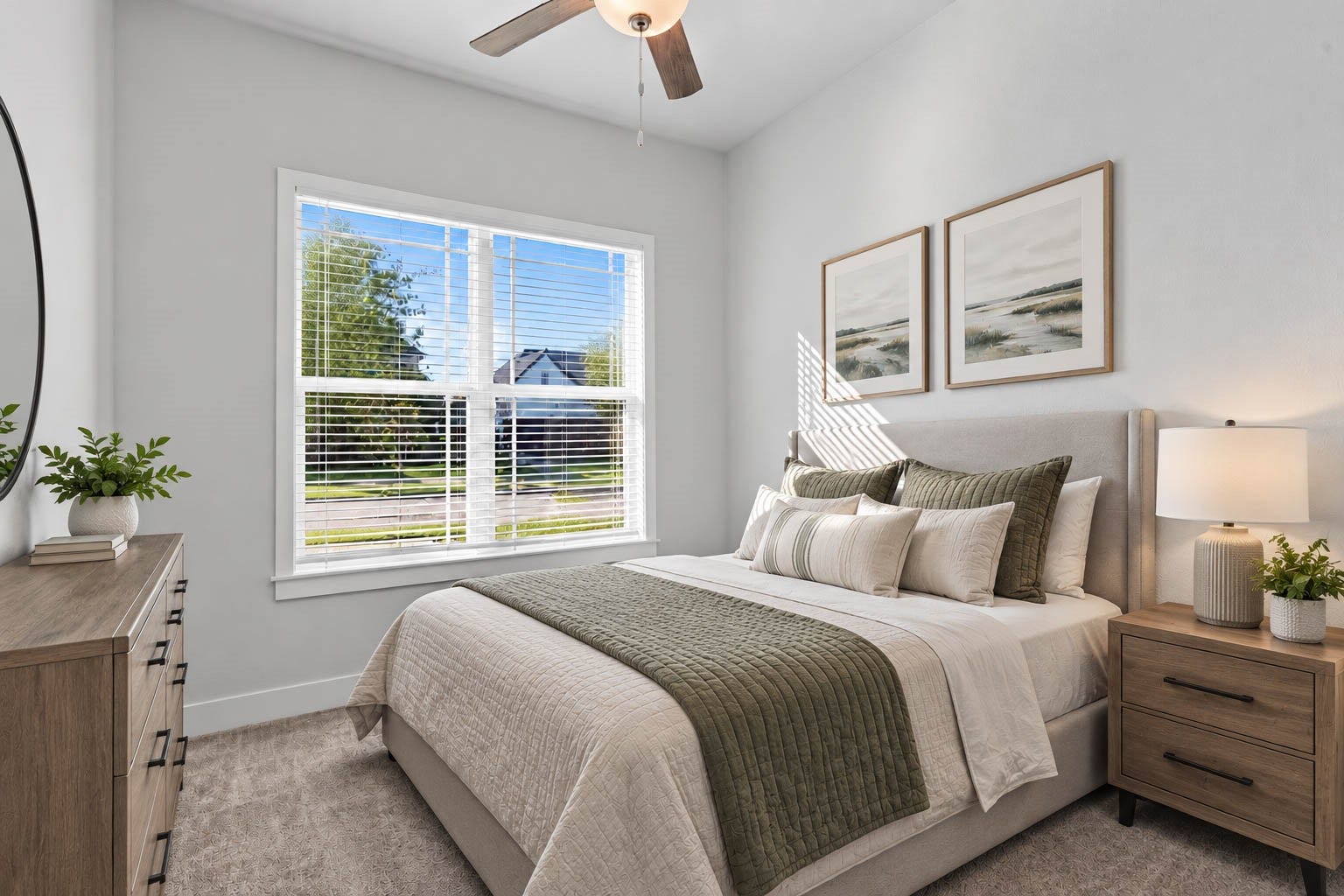 Located at the front of the home, this versatile secondary bedroom features plush carpeting, a ceiling fan, and a large window filling the room with natural lightperfectly suited for a home office, guest suite, or study. *Virtually Staged