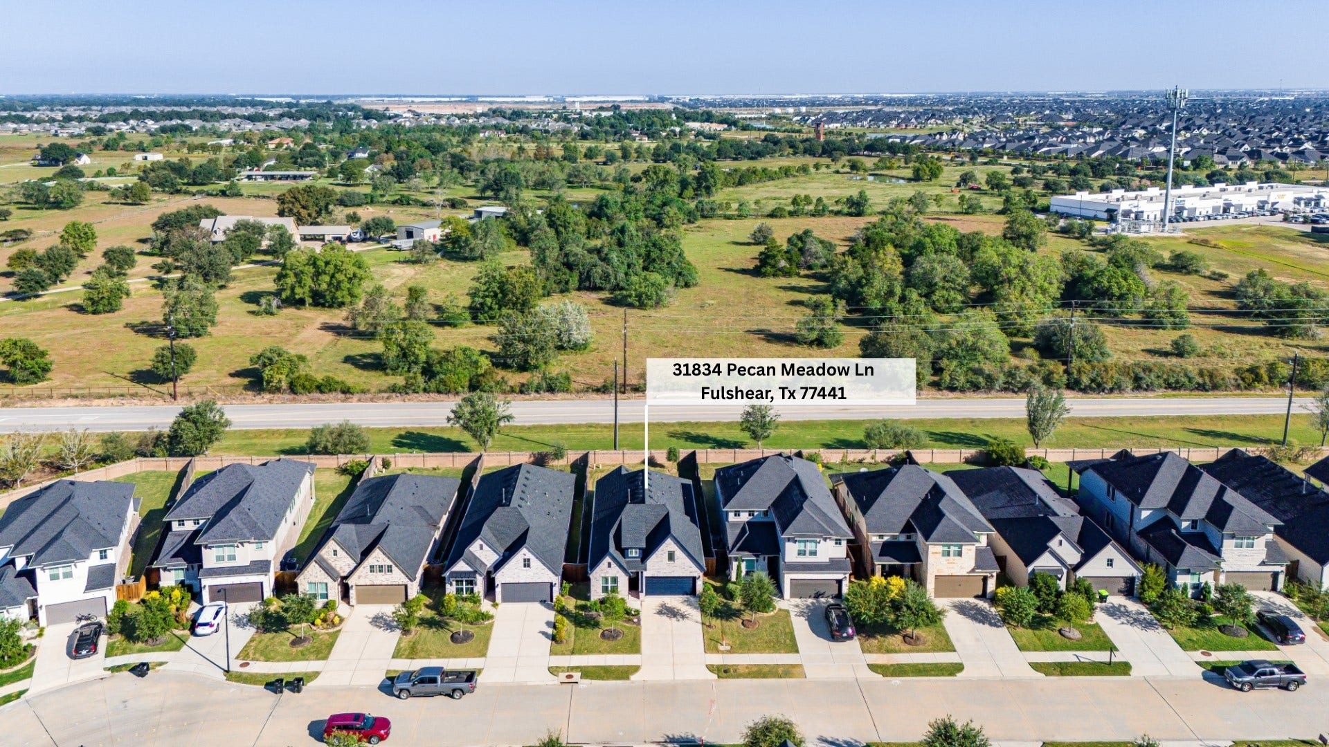 Gorgeous aerial view of 31834 Pecan Meadow Lane's lot placement in the Pecan Ridge community