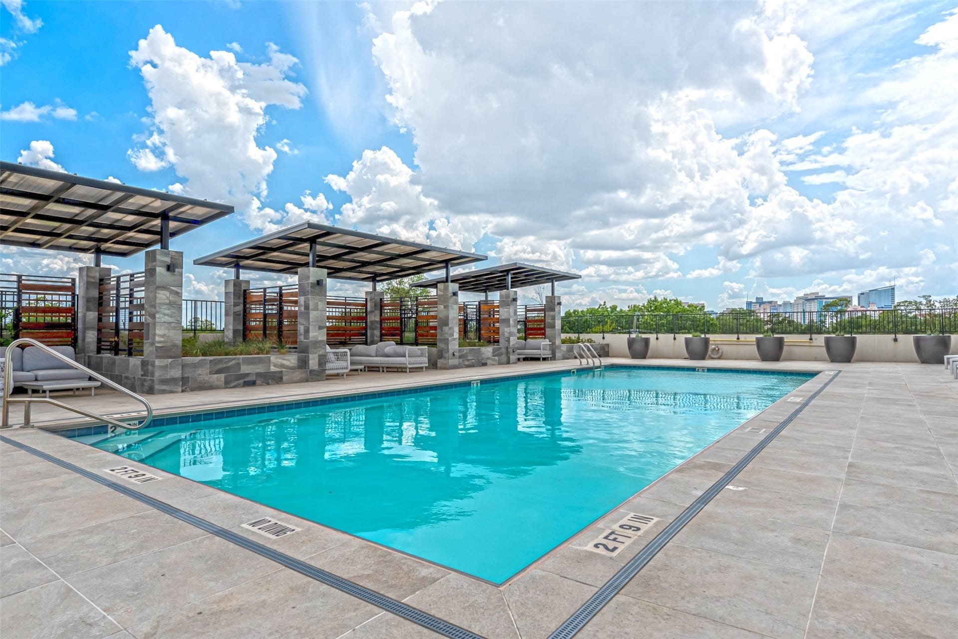 1701 Hermann Drive, #25A, Houston, TX 77004 Numerous cabanas with private seating are perfect shelter from the elements on a hot summer's day.