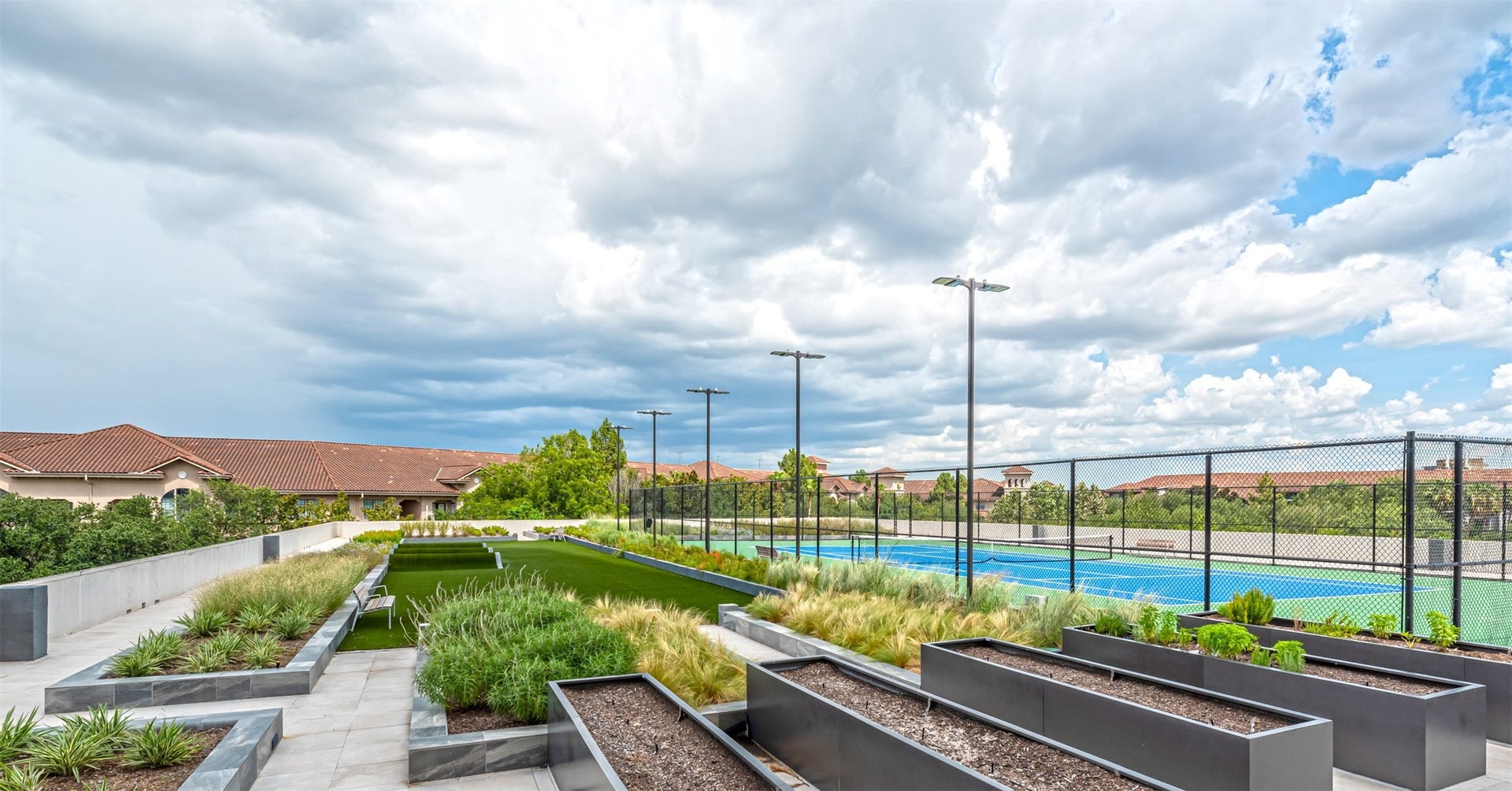 1701 Hermann Drive, #25A, Houston, TX 77004 Third floor amenity deck is your own outdoor park with lit tennis courts, community garden and turfed fitness circuit.