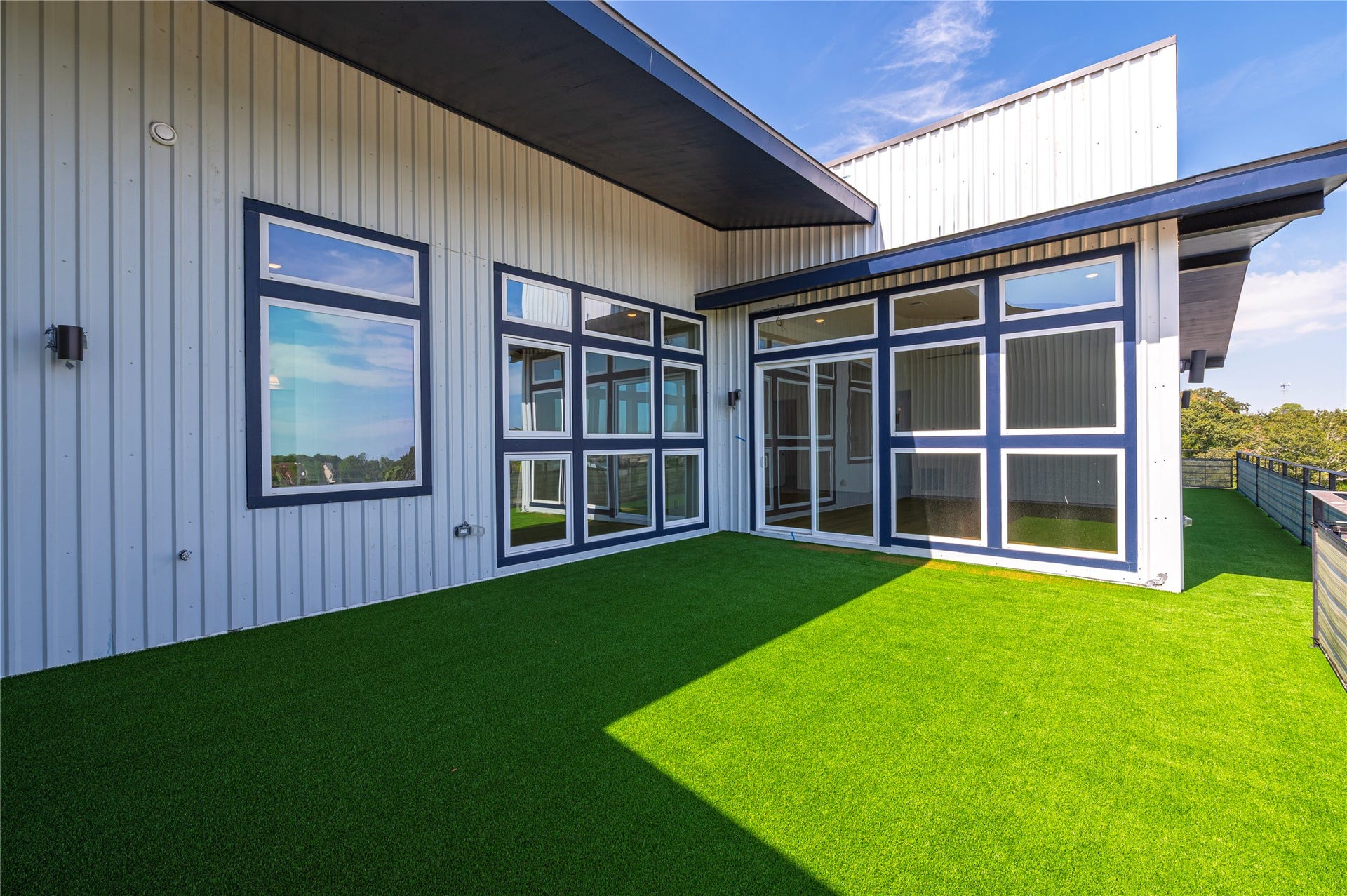 119 Kirby Road, #5304, Taylor Lake Village, TX 77586 The spacious balcony can be finished with vibrant green artificial turf, creating a fresh, polished look and transforming the space into an inviting outdoor living area perfect for relaxing or entertaining.