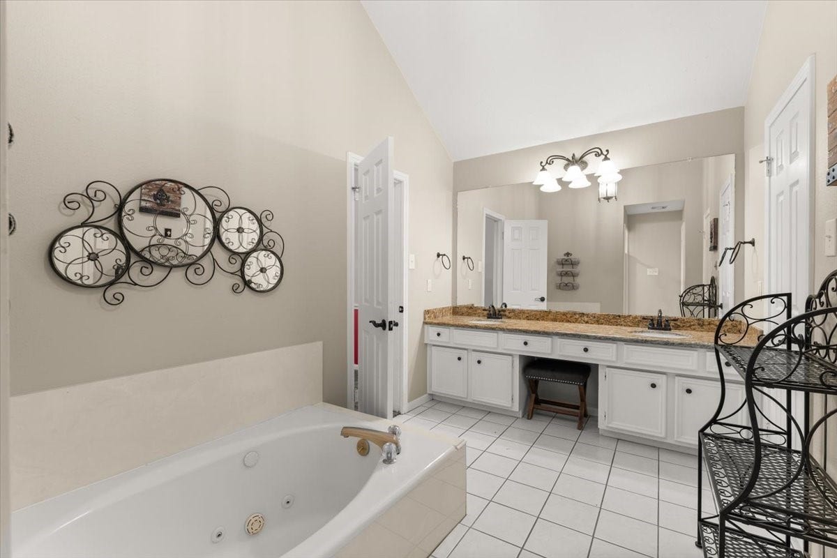 Large jetted tub in primary bathroom
