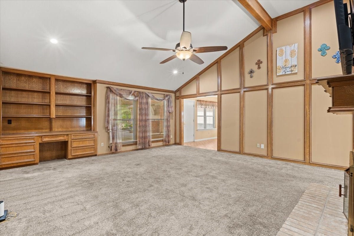 Large windows overlook the beautiful backyard pool, bringing in natural light and creating a relaxing connection between indoor comfort and outdoor living.