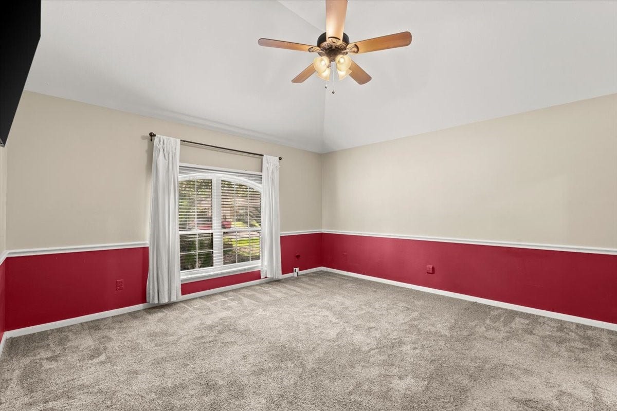 Enjoy a comfortable primary bedroom featuring large windows that invite in natural light