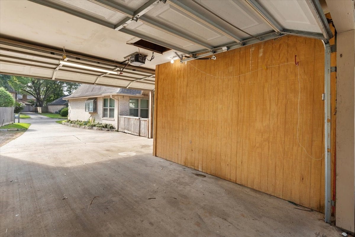 Inside of garage with extra closed in work room