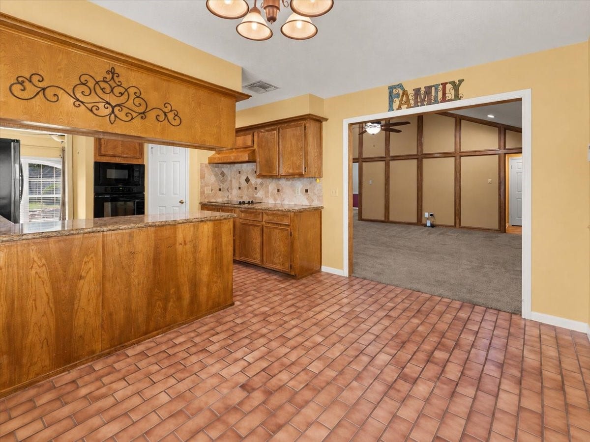 The breakfast area flows seamlessly into the living room, creating an inviting, open feel thats perfect for everyday living and entertaining.