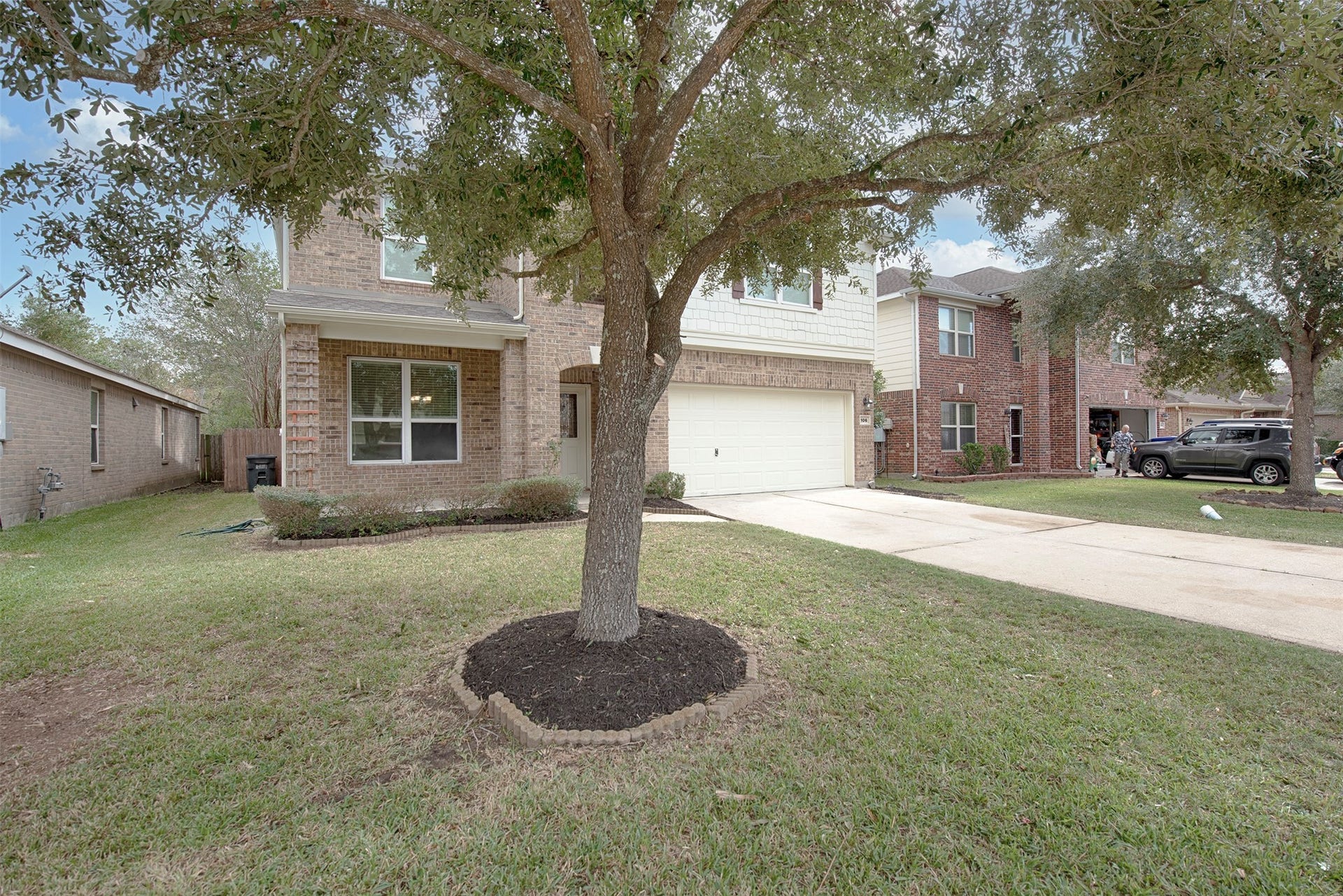 106 Easton Glen Lane, Dickinson, TX 77539 Home has lovely curb appeal as well as terrific additional parking for your guests and brick lined garden.