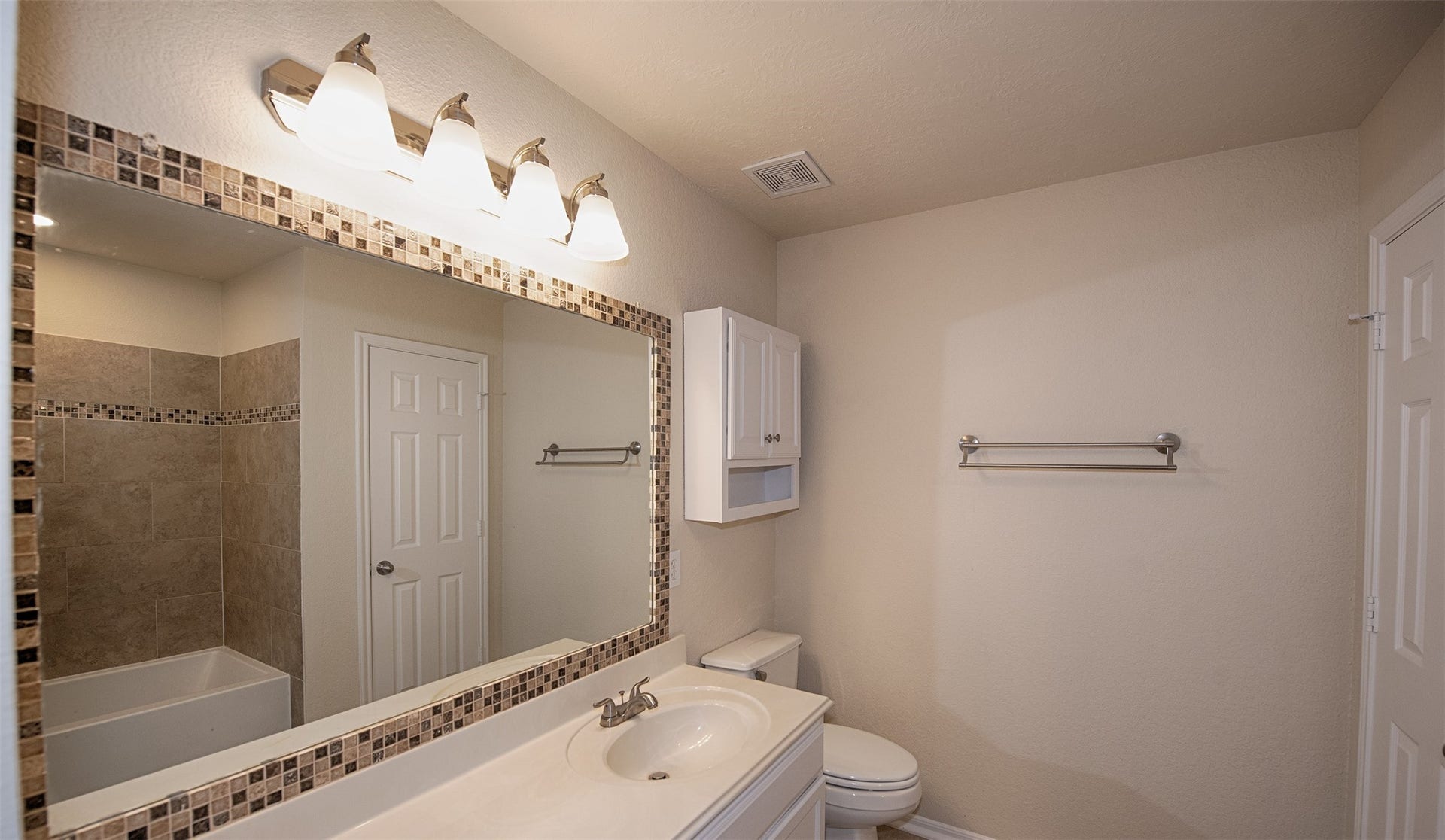 106 Easton Glen Lane, Dickinson, TX 77539 Master bath with updated mirror and extra long vanity.