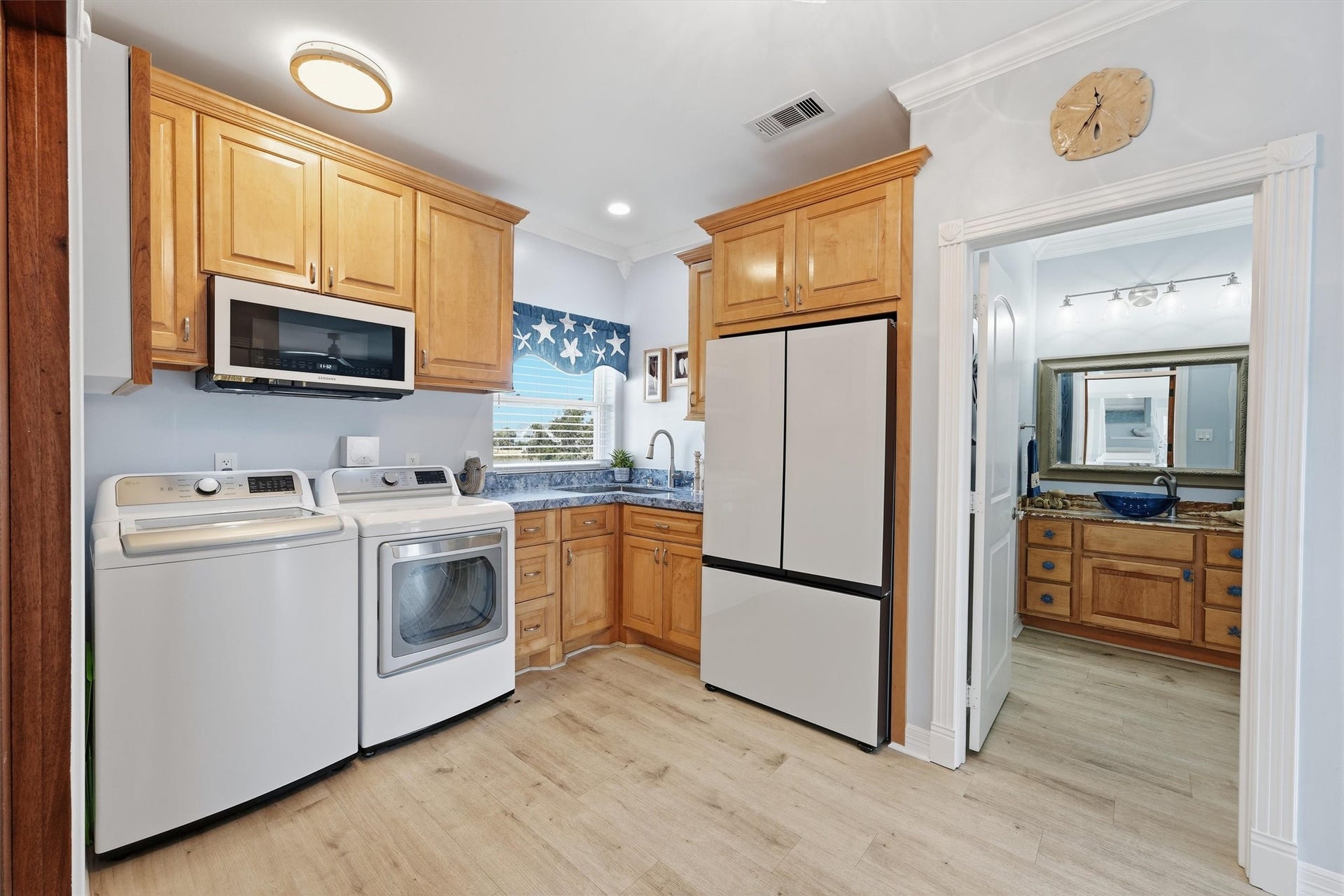 Private guest suite includes its own kitchenette and convenient access to a full bath.