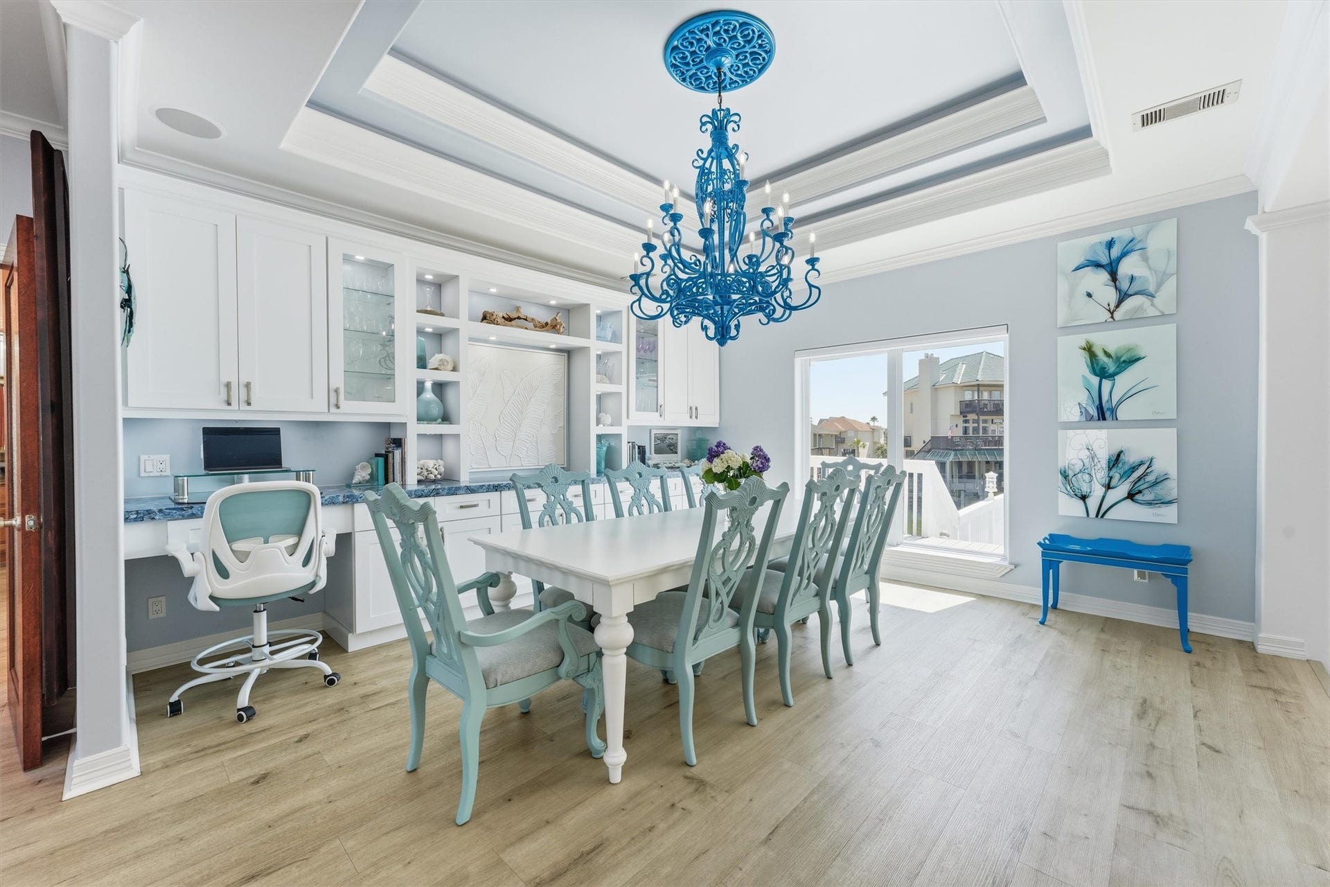Spacious dining area with custom built-ins, detailed ceiling treatment, and plenty of room for gathering and entertaining.