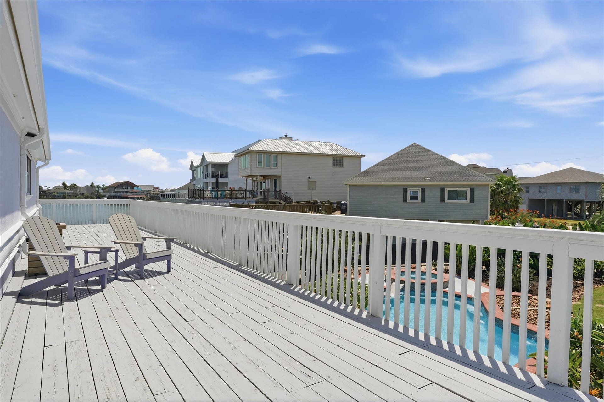 Located just off the primary bedroom, this private balcony overlooks the canal and pool creating a peaceful retreat to enjoy the waterfront setting.