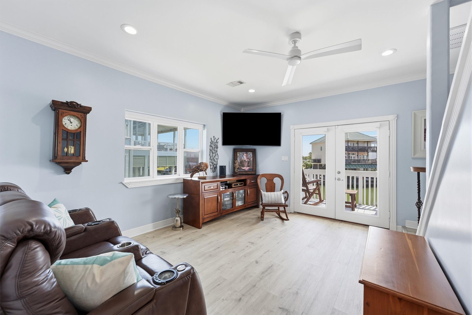 Separate guest living area offers additional space to relax with direct access to an outdoor deck.