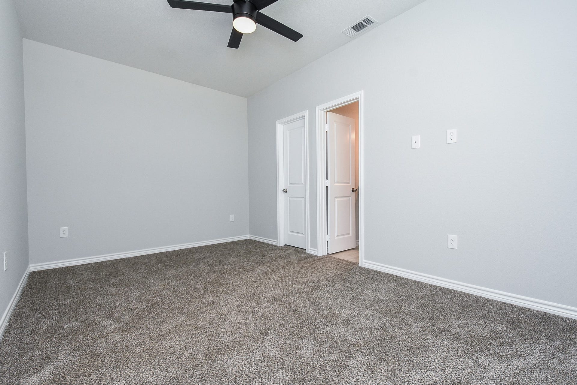 Primary bedroom with closet and en-suite bathroom