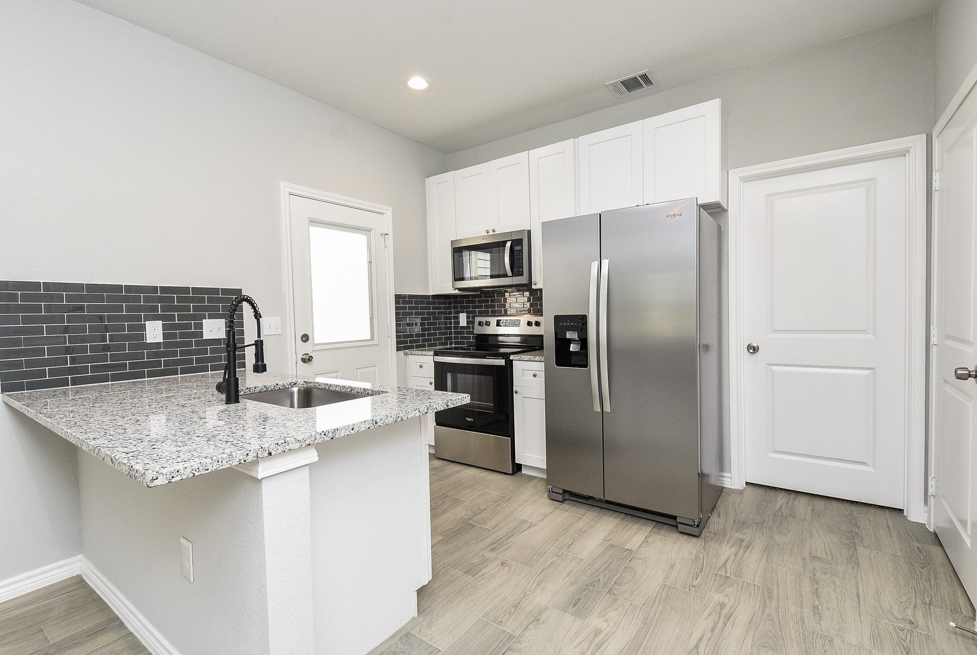 Kitchen with refrigerator included