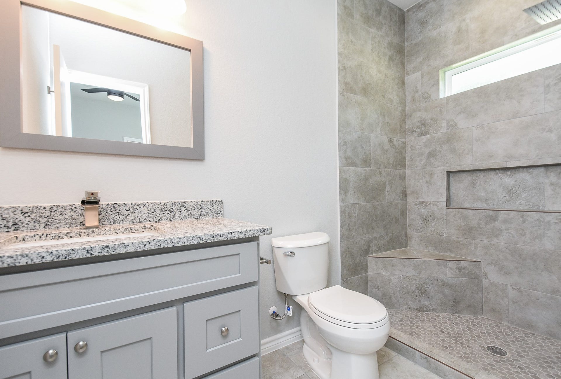 Primary bathroom - a glass shower door has been installed since