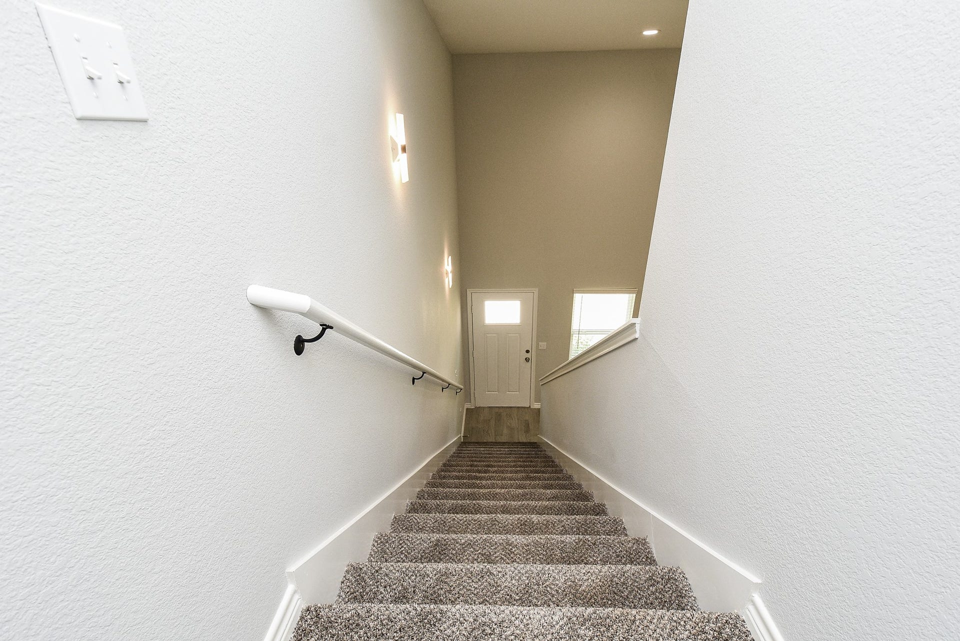 Stairs going to the secondary bedrooms