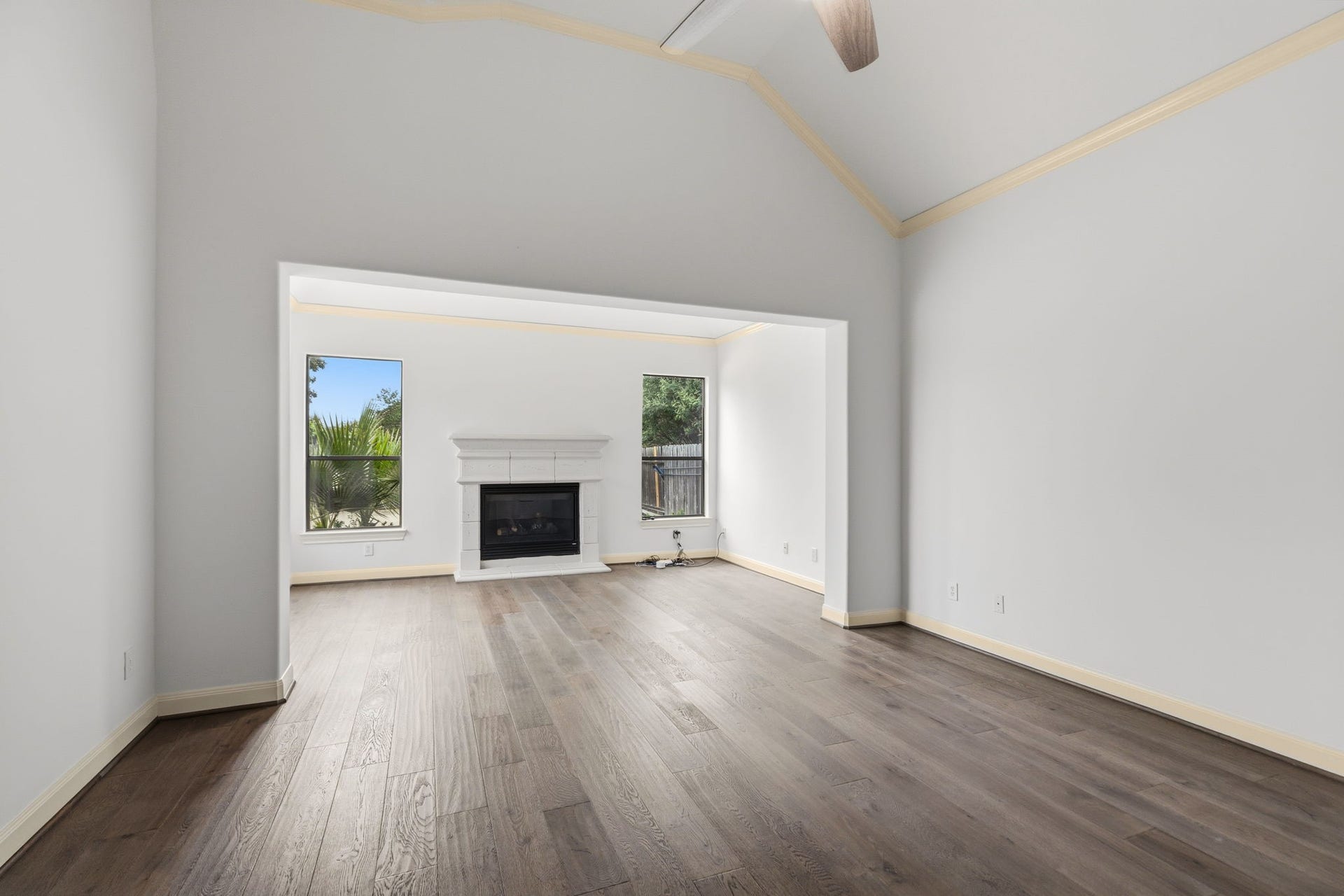 Primary is huge! Vaulted ceilings plus a sitting area with fireplace.